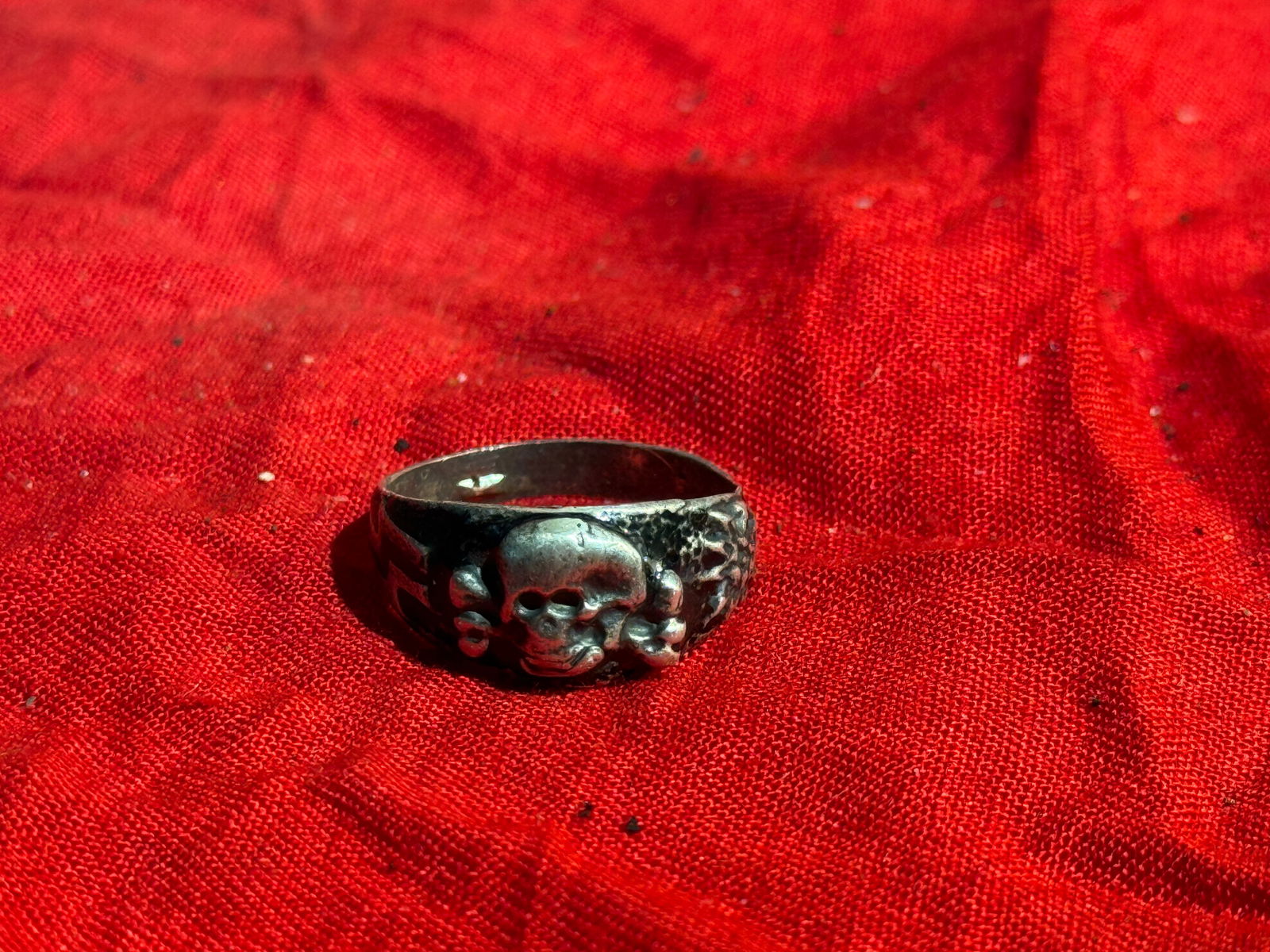 WW2 German Totenkopf-Style Skull Silver Ring: Silver ring featuring a raised skull and crossbones (Totenkopf) motif, a symbol historically associated with German military units and later adopted by several organizations during the early–mid 20t