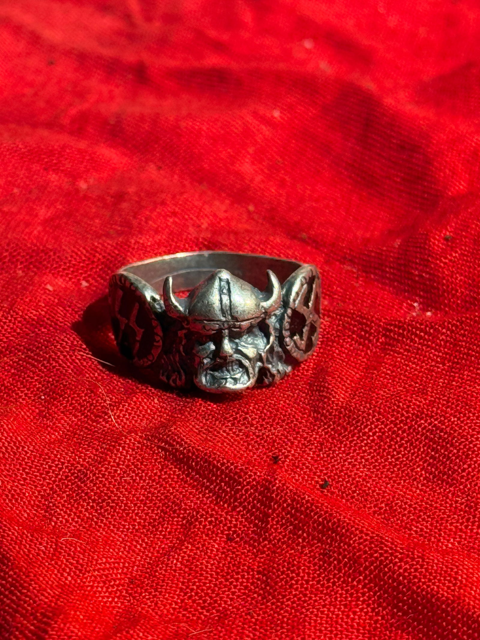 Rare WW2 German Wiking SS Silver Ring: Rare WW2 German Wiking SS Silver Ring. Silver ring featuring a Viking warrior head with horned helmet at the center, flanked by circular panels bearing SS Sig rune symbols and a swastika motif, incorp
