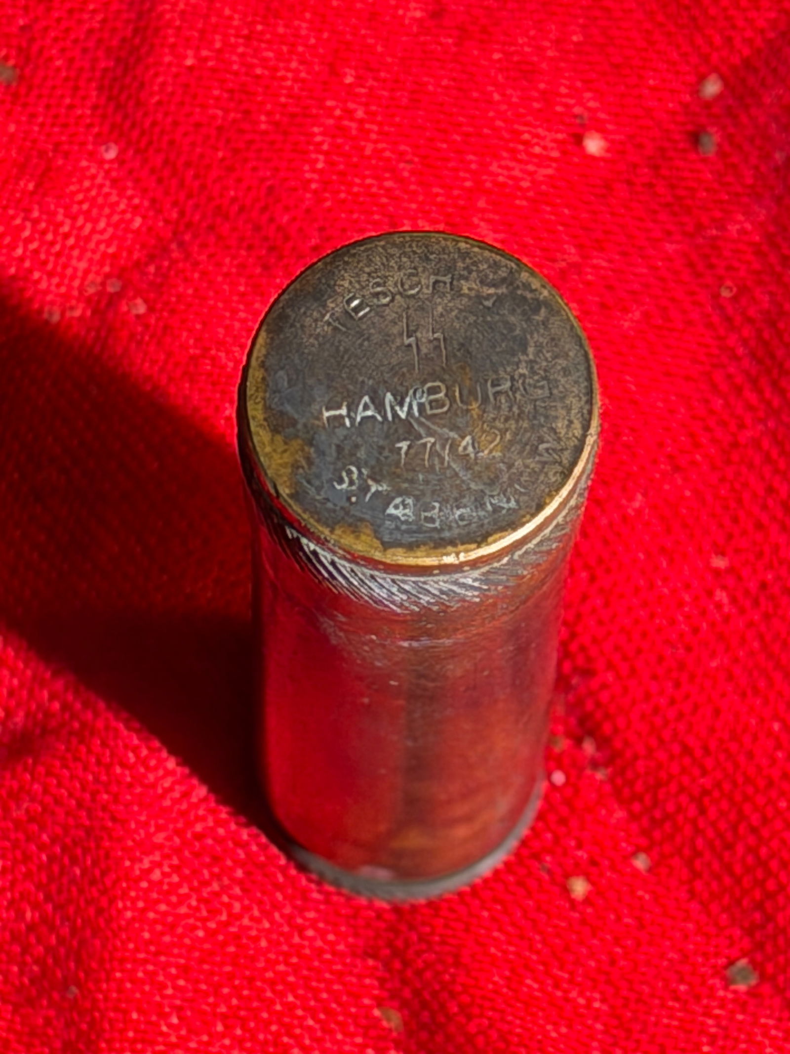 Rare WW2 German Waffen SS Hamburg Cyanide Capsule Case - Empty: This small cylindrical brass container is a German match safe or waterproof match holder, produced in Hamburg, Germany by the manufacturer TESOR. The base is stamped “TESOR – HAMBURG” with