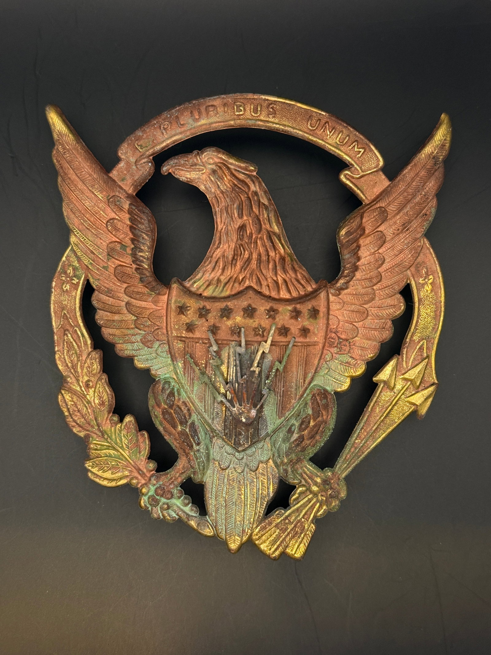 Rare Indian Wars Telegrph Telecommunications Shako Hat Badge Insignia: This cast metal emblem depicts the United States eagle beneath the national motto “E Pluribus Unum” (“Out of many, one”), with spread wings, shield, olive branch, and arrows—traditio