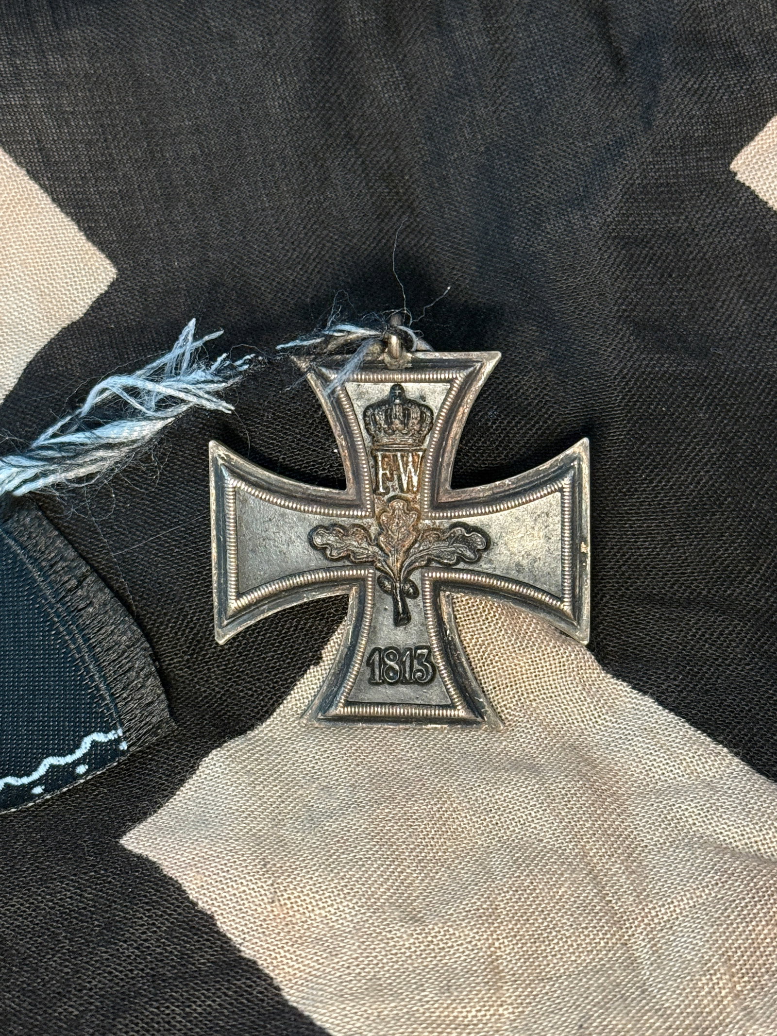 WW2 Iron Cross, Second Class (Eisernes Kreuz II. Klasse), 1914 – German Empire: This medal is the Iron Cross, Second Class, instituted during the First World War by the German Empire. The decoration features the distinctive blackened iron cross pattée bordered by silver. On the