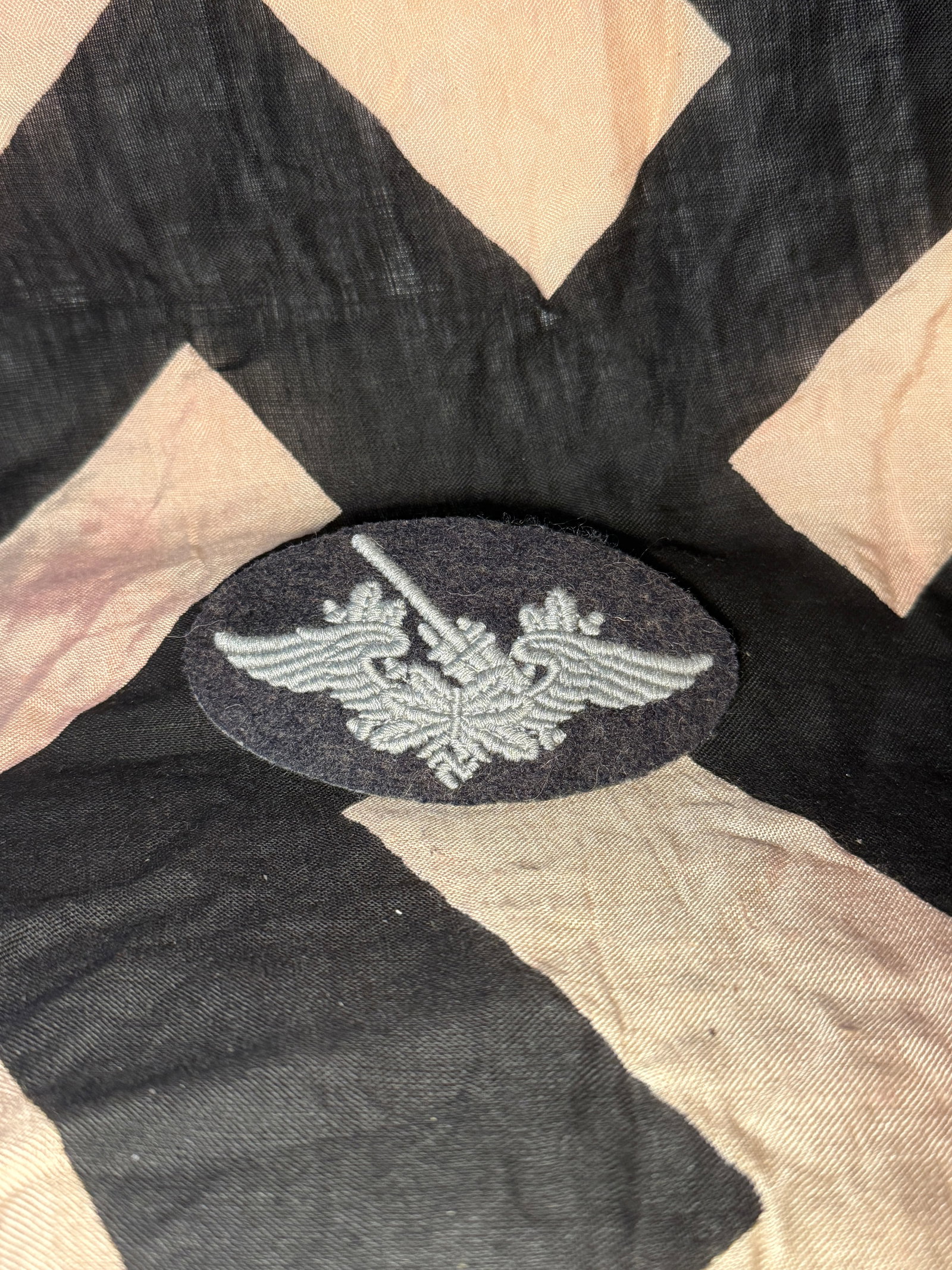 WW2 Luftwaffe Air Signals / Communications Trade Sleeve Badge: This embroidered cloth insignia represents a Luftwaffe trade or specialty badge, worn by personnel trained in air signals or communications duties within the German Air Force during the Second World W
