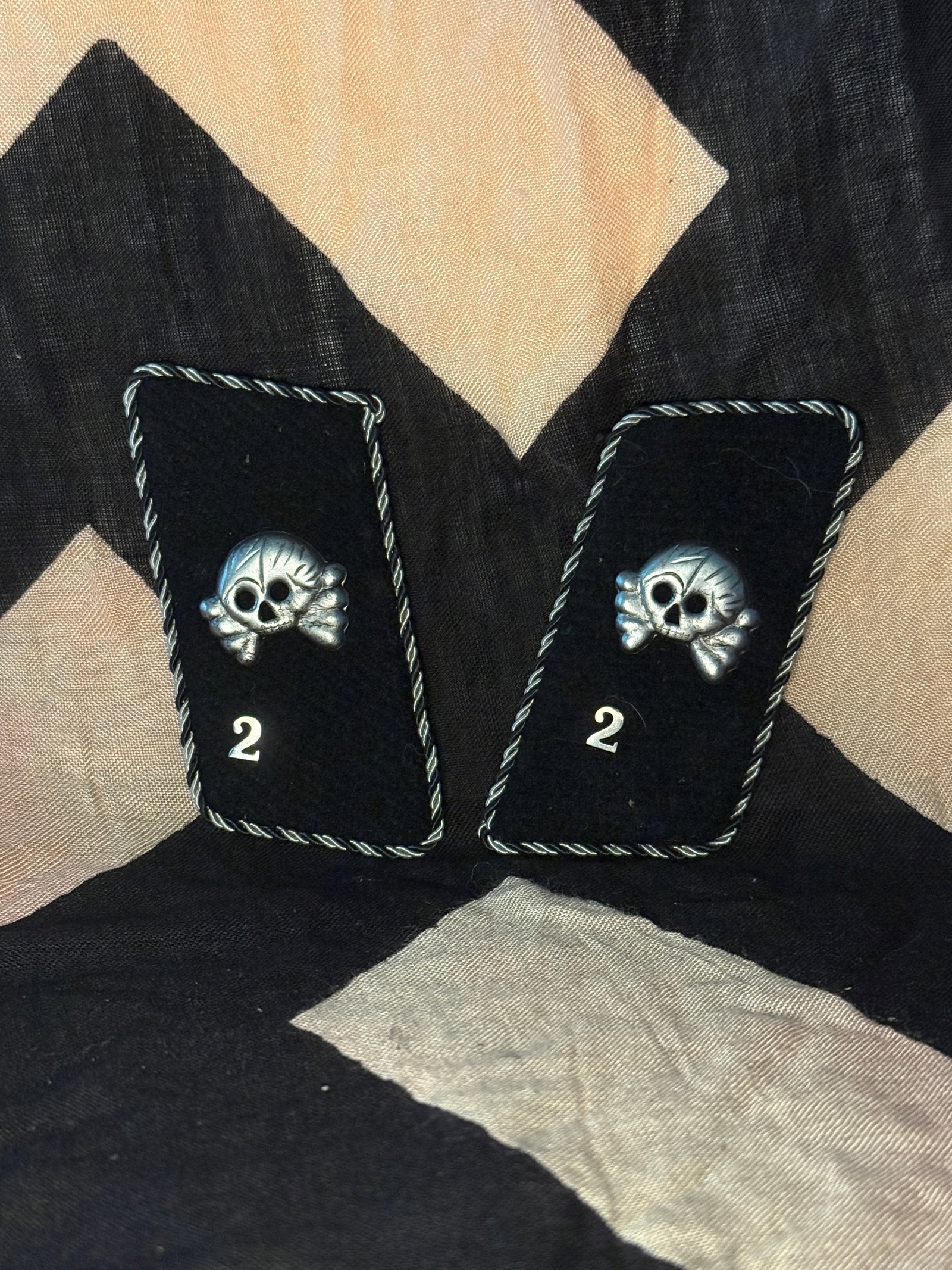 WW2 German SS Totenkopf Collar Tabs for the 2nd SS Panzer Division “Das Reich,?? With RZM Paper: This matched pair of black cloth collar tabs features the Totenkopf (death’s head) skull emblem above the numeral “2,” indicating association with the 2nd SS Panzer Division “Das Reich,&rd