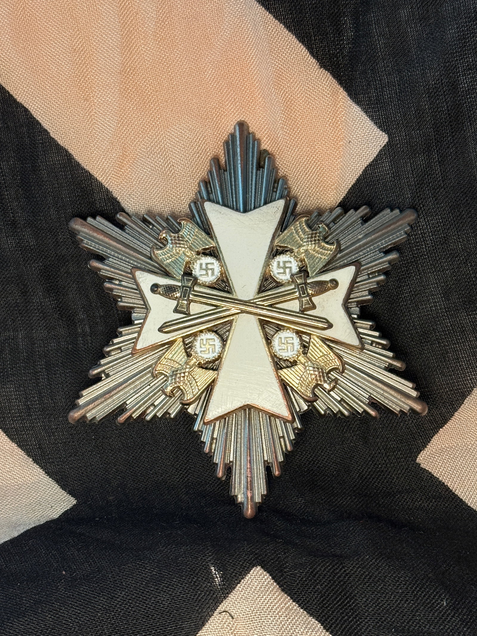 WW2 German War Merit Cross, First Class with Swords (Kriegsverdienstkreuz 1. Klasse mit Schwertern),: This metal breast badge represents the War Merit Cross, First Class with Swords, an award of Nazi Germany established in 1939 during the Second World War. The decoration features a silvered eight-poin