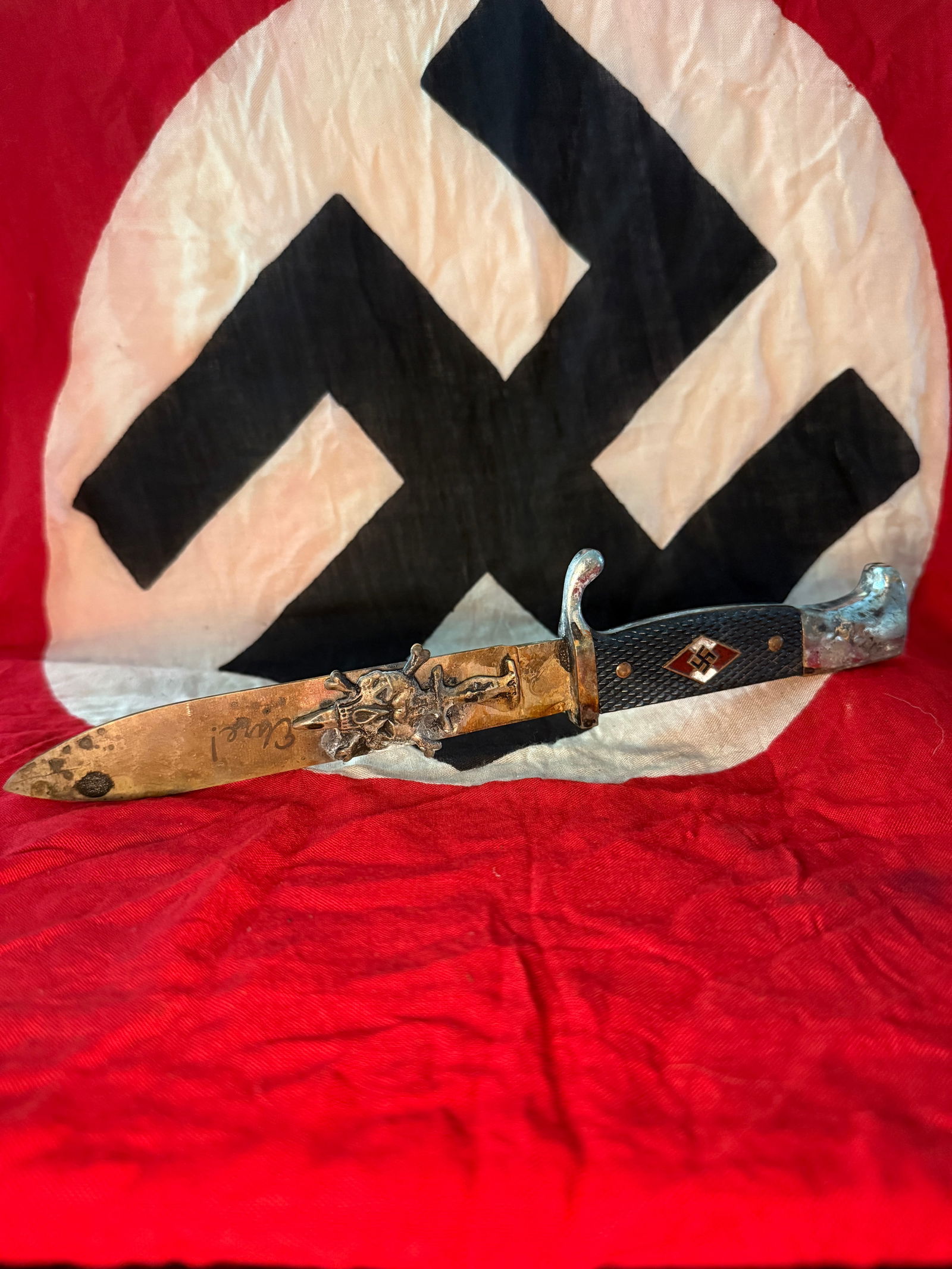 GERMAN WWII Hitler Youth Knife (Hitlerjugend Fahrtenmesser): This knife is a Hitler Youth (Hitlerjugend) utility knife, commonly carried by members of the Nazi youth organization. The design was based on earlier German military-style knives and featured a strai