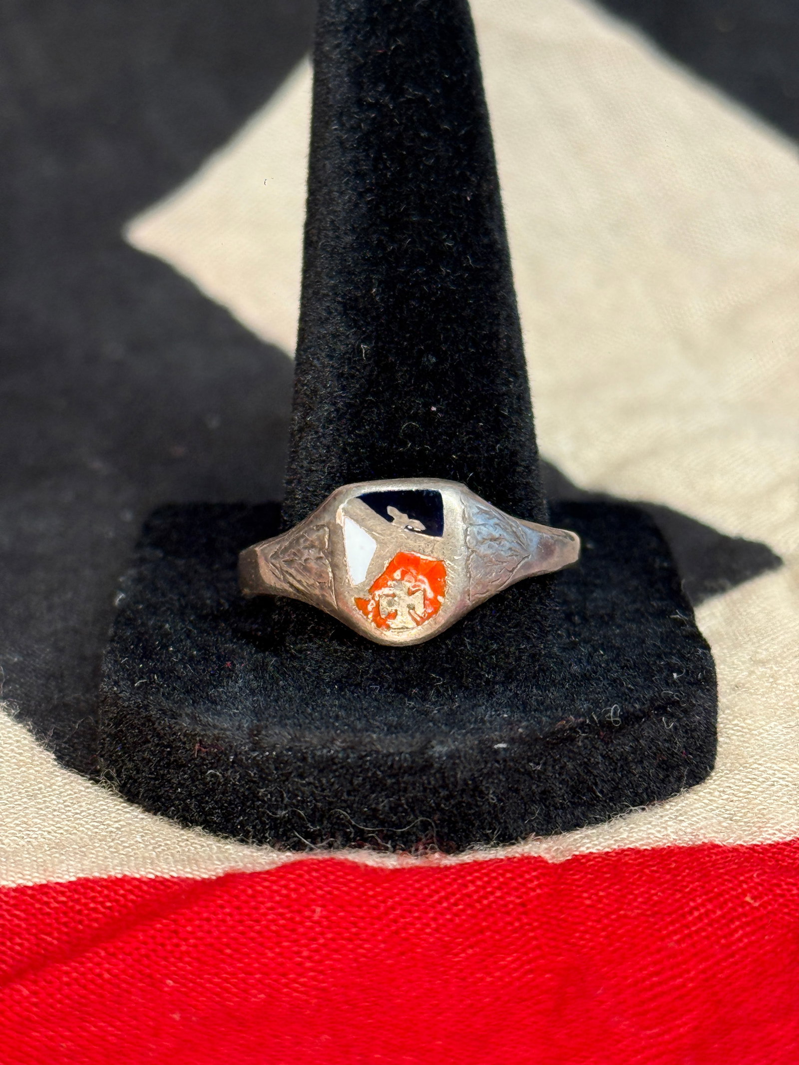 WW1 German Normandy Tri Color 835 Silver Ring: A silver ring featuring enamel panels in black, white, and red, with stylized symbolic motifs. The interior is stamped “835,” indicating silver content. While inspired by the SS Honor Ring (To