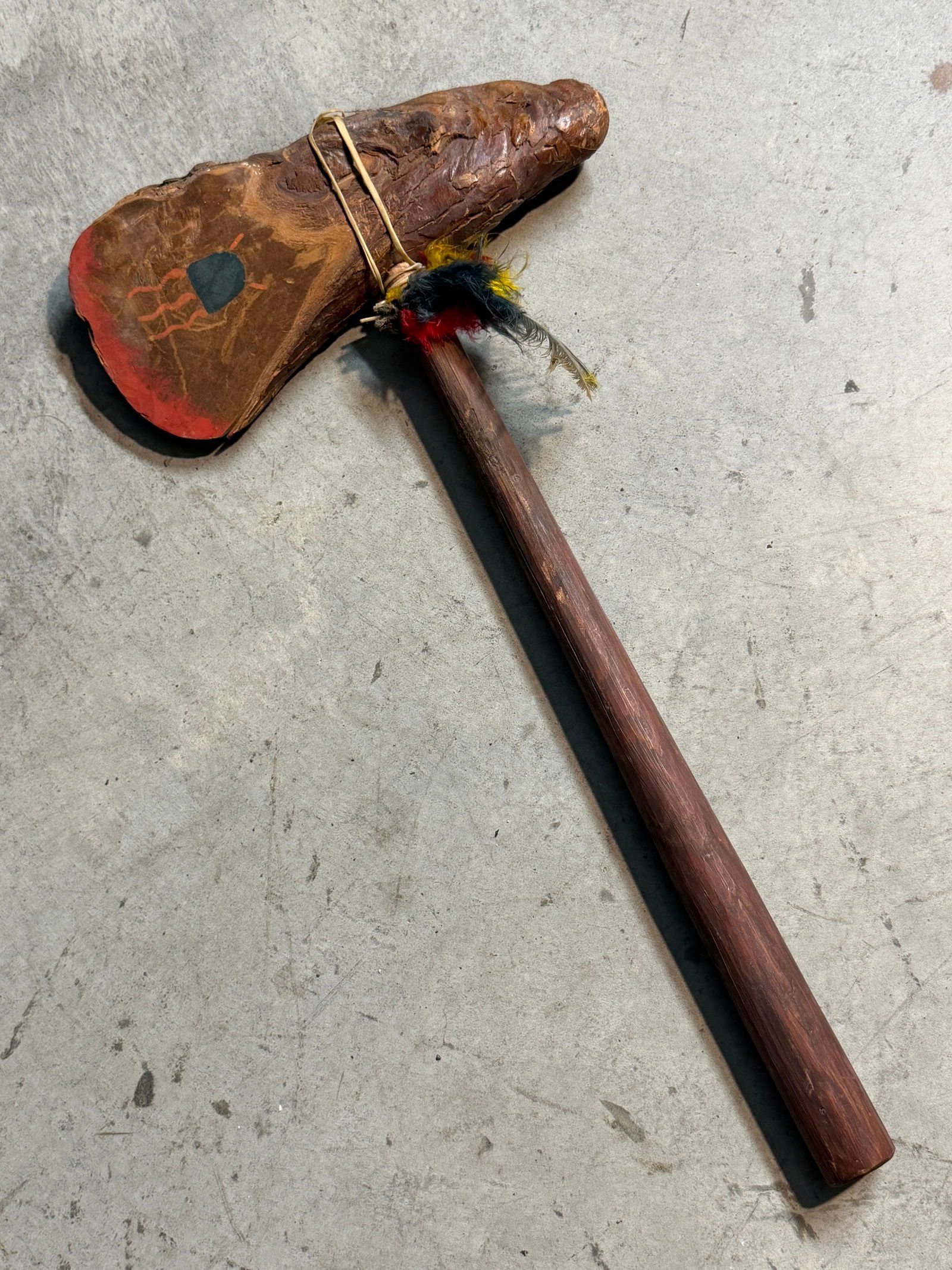 Native American Carved Wooden Plains-Style Ceremonial Club with Painted Symbolism, Late 19th–Early: This carved wooden club, likely inspired by Plains Indigenous forms, reflects the enduring cultural significance of handheld ceremonial and symbolic objects in Native North America. The head, carved f