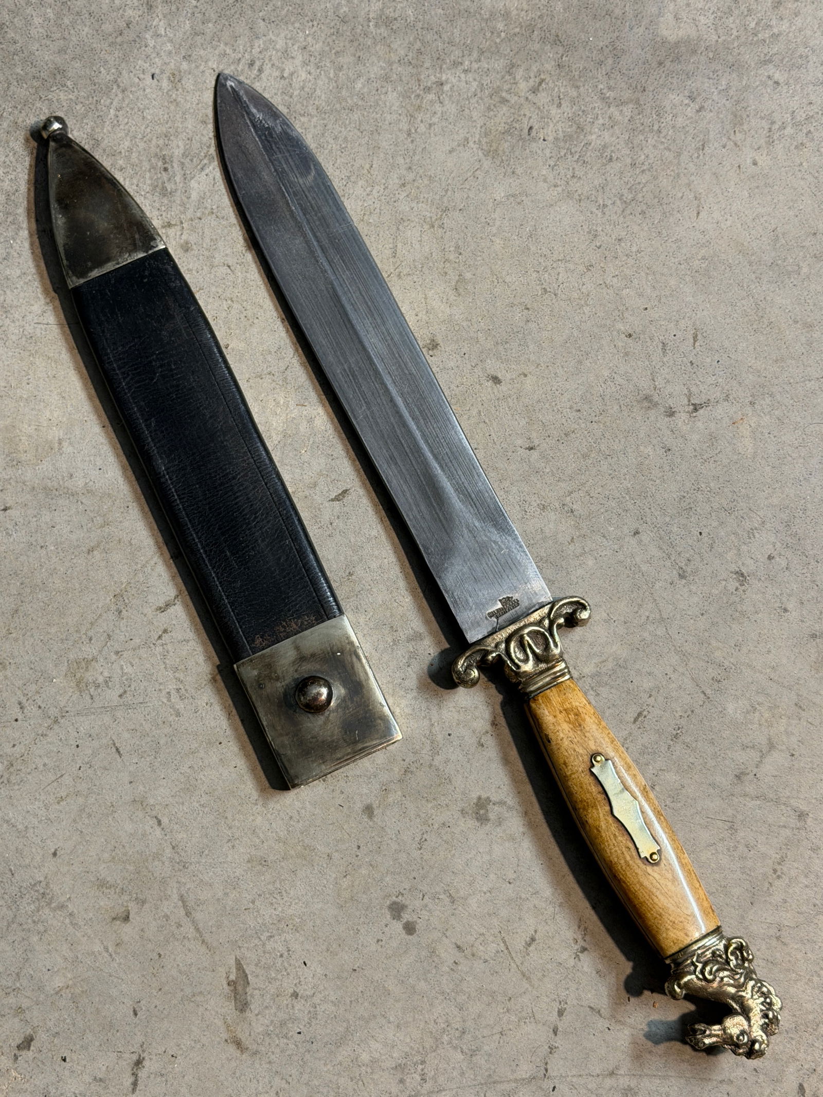 Walker & Hall Sheffield-Made Bowie Knife with Ornate Horse-Head Hilt, 19th Century: This 19th-century Bowie knife, manufactured in Sheffield, England, represents the height of decorative yet functional blade production during the era of transatlantic trade. The blade bears a stamped