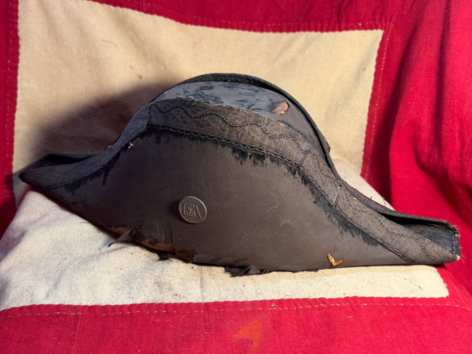 American Revolutionary War Cocked Hat (Tricorn) with “USA?? Button, Late 18th Century: This rare surviving example of an American Revolutionary War–era cocked hat, commonly known as a tricorn, reflects the distinctive military and civilian headwear of the late 18th century. Constructe