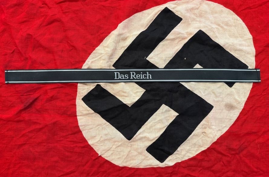 WWII German SS “Das Reich?? Cuff Title (Waffen-SS Division Insignia): This cuff title is inscribed “Das Reich,” identifying the 2nd SS Panzer Division, a major Waffen-SS formation active on multiple fronts. Cuff titles were worn on the sleeve to signify division