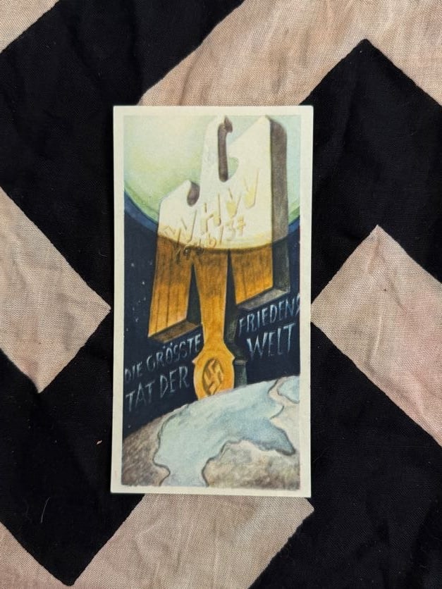 WWII-Era German WHW Propaganda Card “Die größte Tat der Welt – Frieden,?? c. late 1930s: This card presents symbolic imagery accompanied by the phrase “The greatest deed in the world – peace.” Produced in the late 1930s, it reflects messaging that framed national ambitions in te