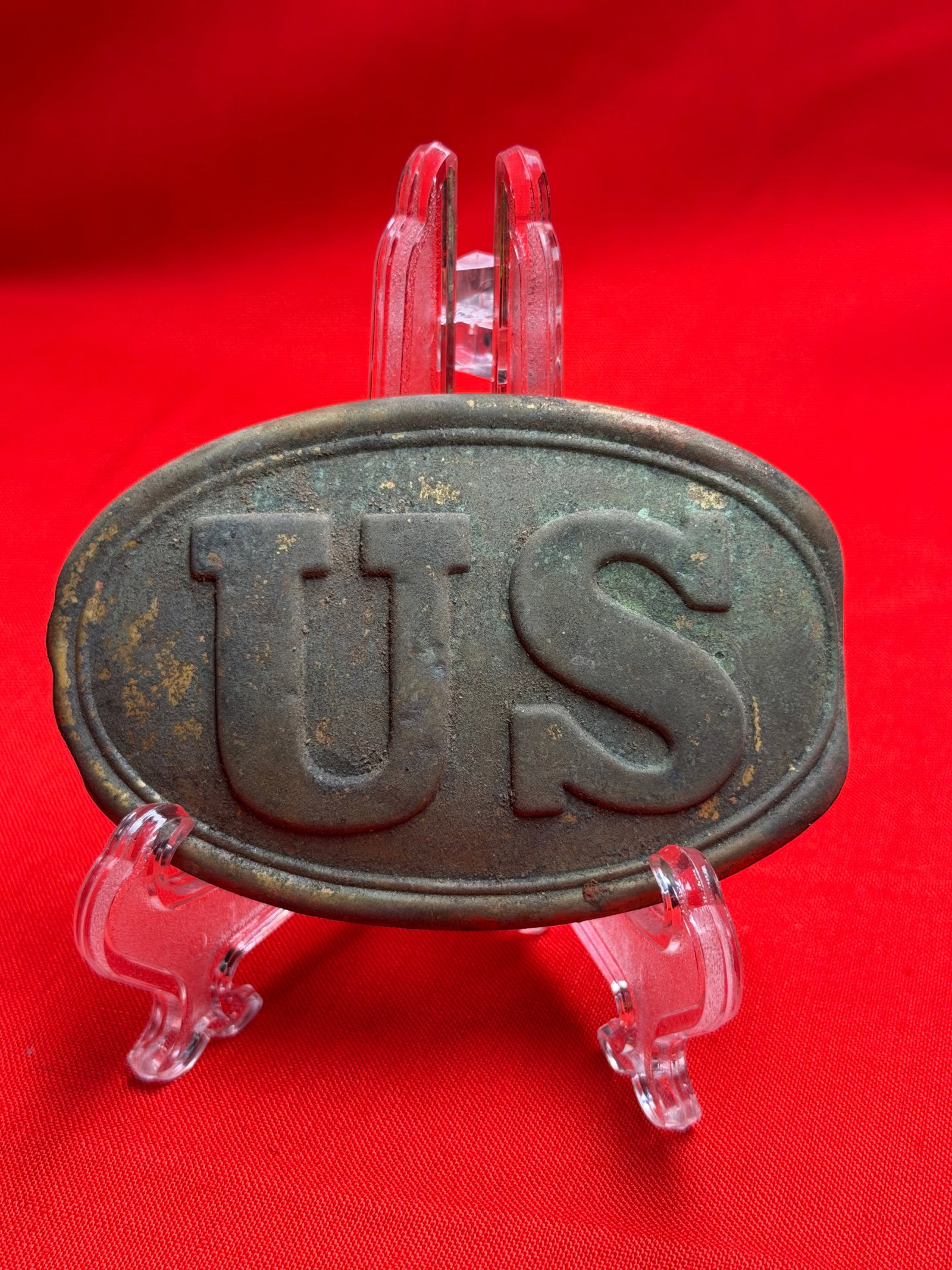 Civil War Style U.S. Oval Belt Plate Buckle – Dug Relic: Civil War–style U.S. oval belt plate featuring the classic raised “US” lettering. This type of buckle was widely used by Union soldiers during the American Civil War. The plate shows heavy a
