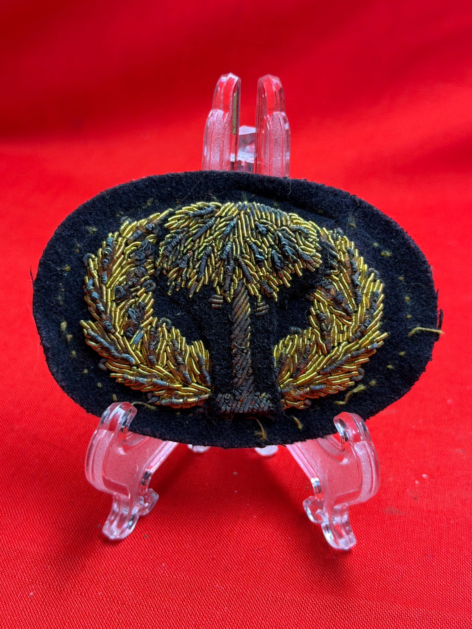 Civil War Confederate CSA South Carolina Palmetto Tree Bullion Headgear Badge By J.H. Silverberg: This oval-shaped headgear badge features finely worked bullion embroidery depicting a palmetto tree centered within a wreath, a design closely associated with South Carolina during the Civil War era.