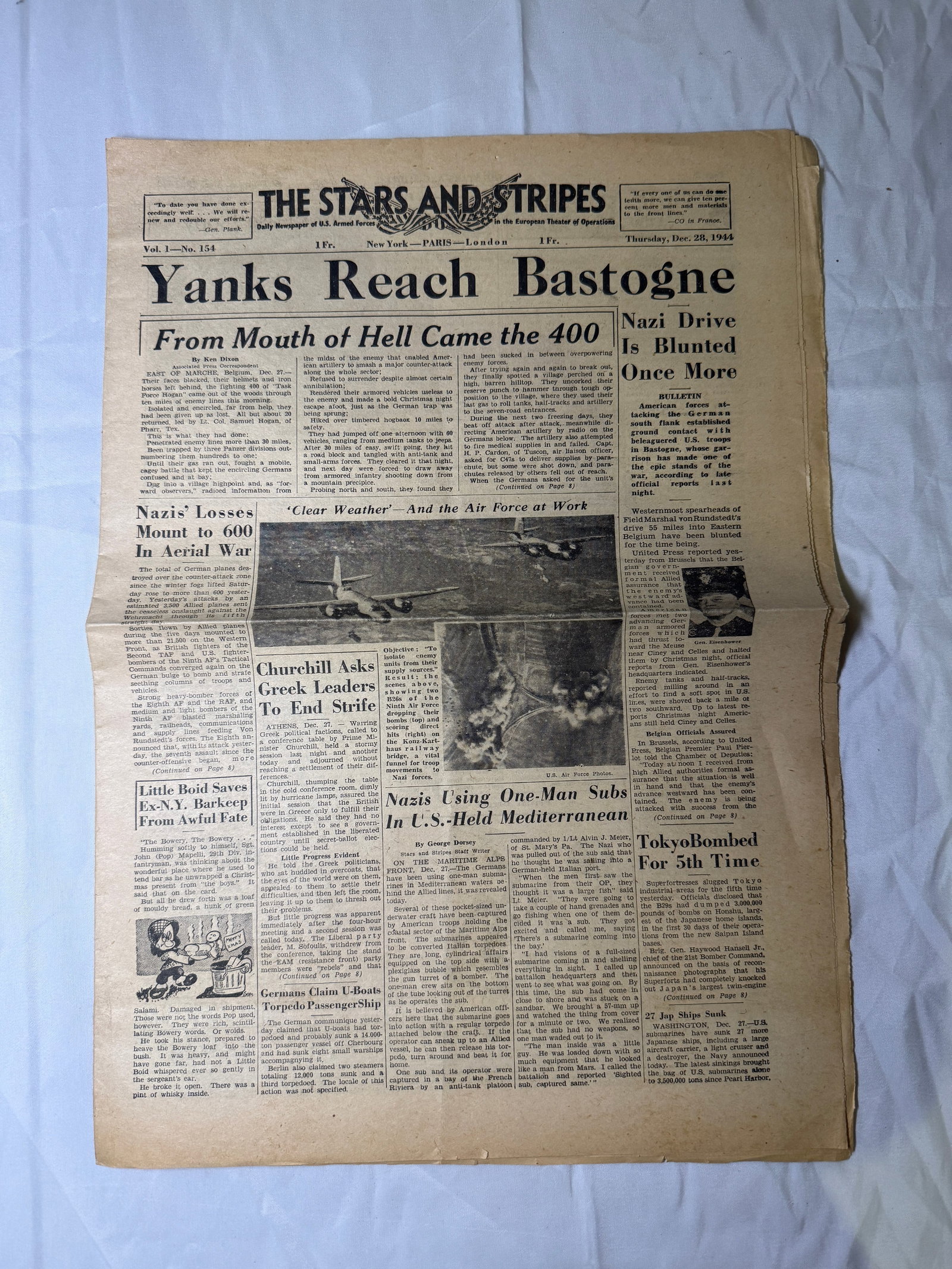 WWII “Stars and Stripes?? Bastogne Front Newspaper (Dec. 28, 1944): This original wartime issue of The Stars and Stripes, dated December 28, 1944, reports on the critical stages of the Battle of the Bulge, with the bold headline “Yanks Reach Bastogne.” Printed