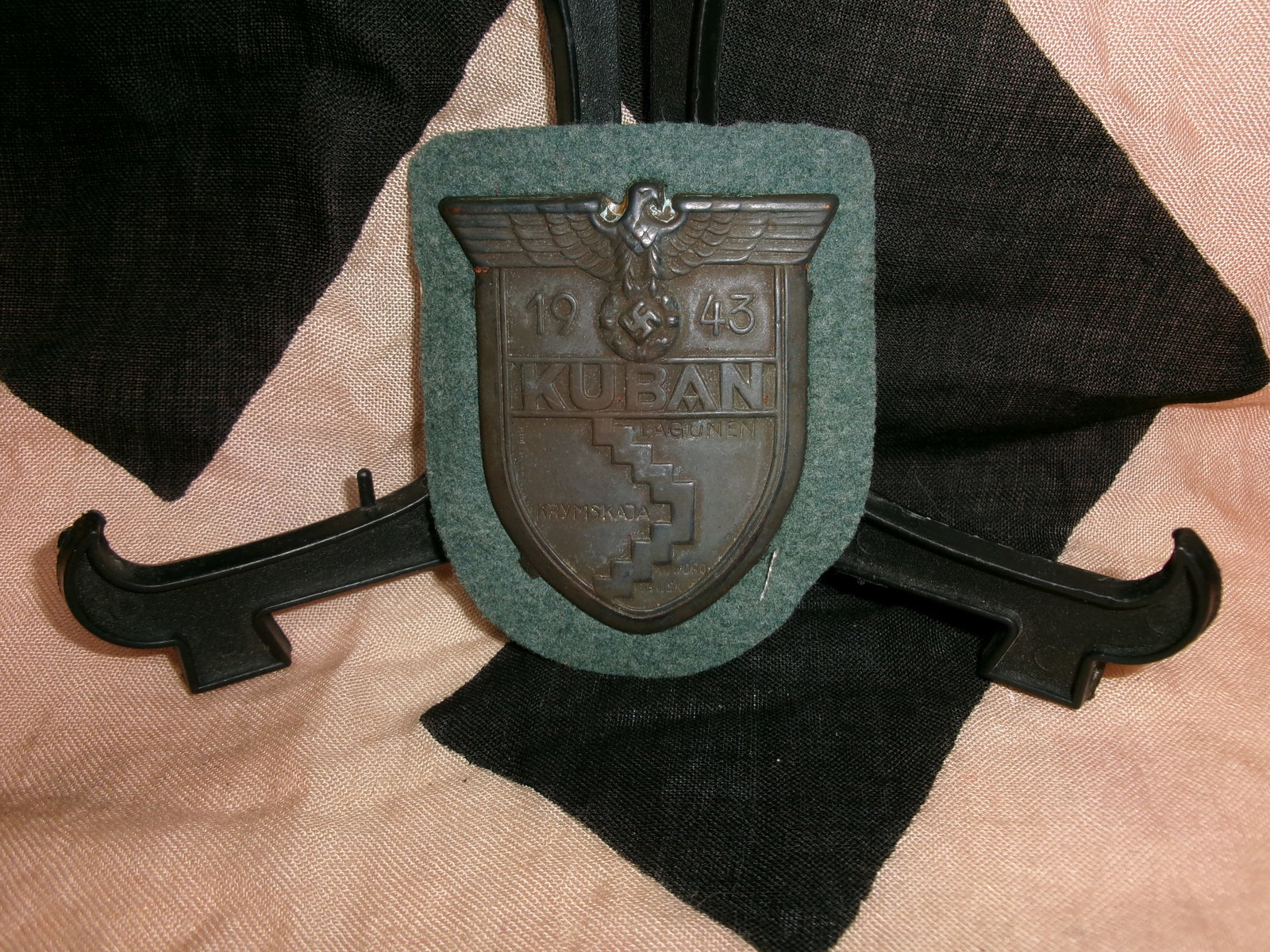 WWII German Kuban Campaign Shield (1943): A shield-shaped German campaign award issued to ?????? who served in the Kuban bridgehead on the Eastern Front in 1943. Featuring an eagle above the date “1943” and the inscription “KUBAN,&r