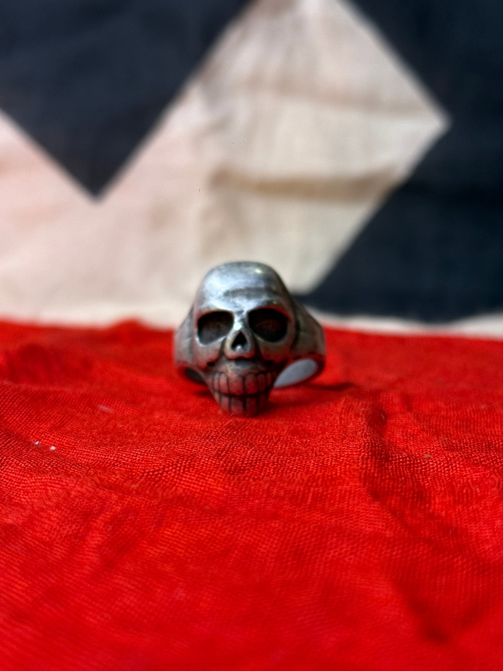 WWII German Totenkopf SS Skull Ring: This ring features a prominent skull motif with hollow eye sockets and detailed teeth, evocative of the “Totenkopf” (death’s head) symbolism widely used in German military and paramilitary u
