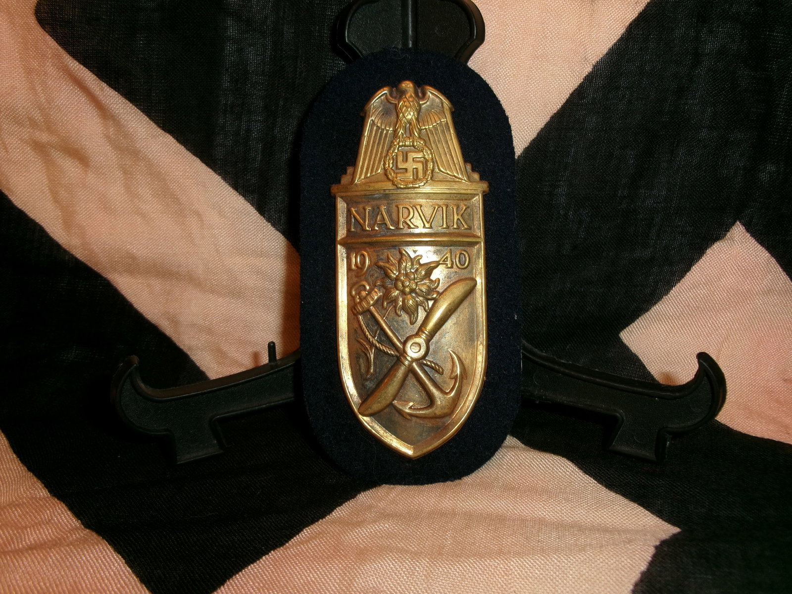 WWII German Narvik Campaign Shield (Narvikschild): This shield-shaped award commemorates participation in the 1940 campaign in Norway, particularly the battles around Narvik. The design includes the inscription “NARVIK 1940”, a national eagle 