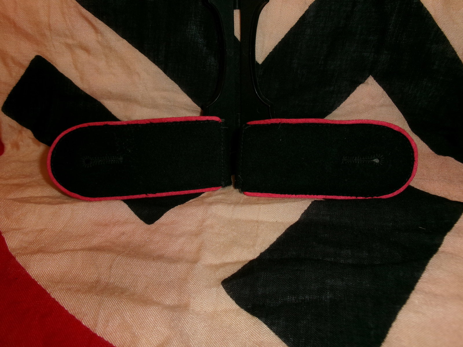 WWII German Waffen-SS Totenkopf Officer Shoulder Boards (Pair): This matched pair of black cloth shoulder boards features a vivid red piping along the outer edges, indicative of branch-of-service coloration. The boards are constructed with a wool base and reinforc