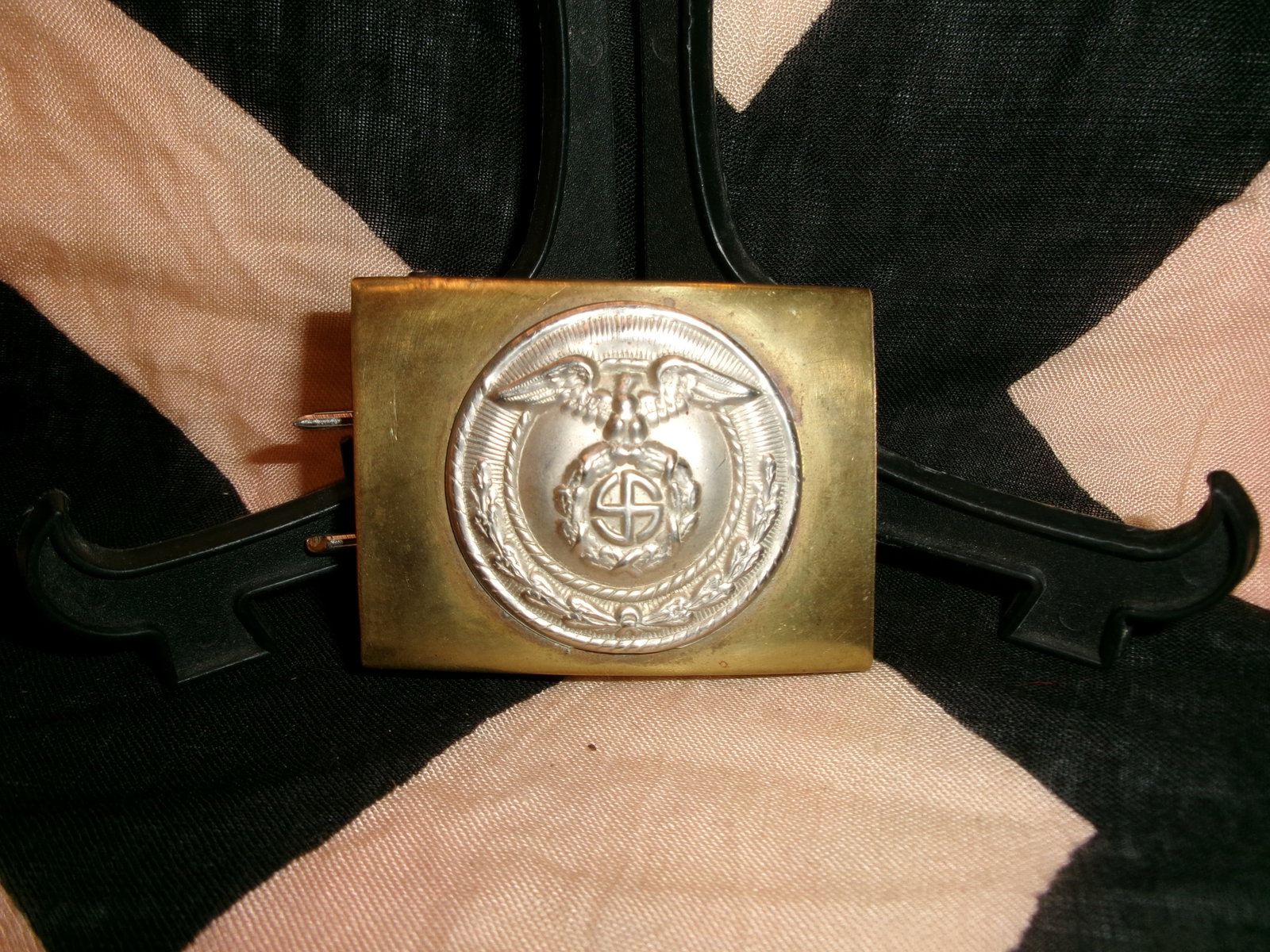 WWII German SA (Sturmabteilung) Belt Buckle Marked M4/14: This rectangular brass belt buckle features a central roundel with a spread-wing eagle clutching a wreath enclosing a swastika, surrounded by a rope-pattern border. The reverse shows attachment prongs