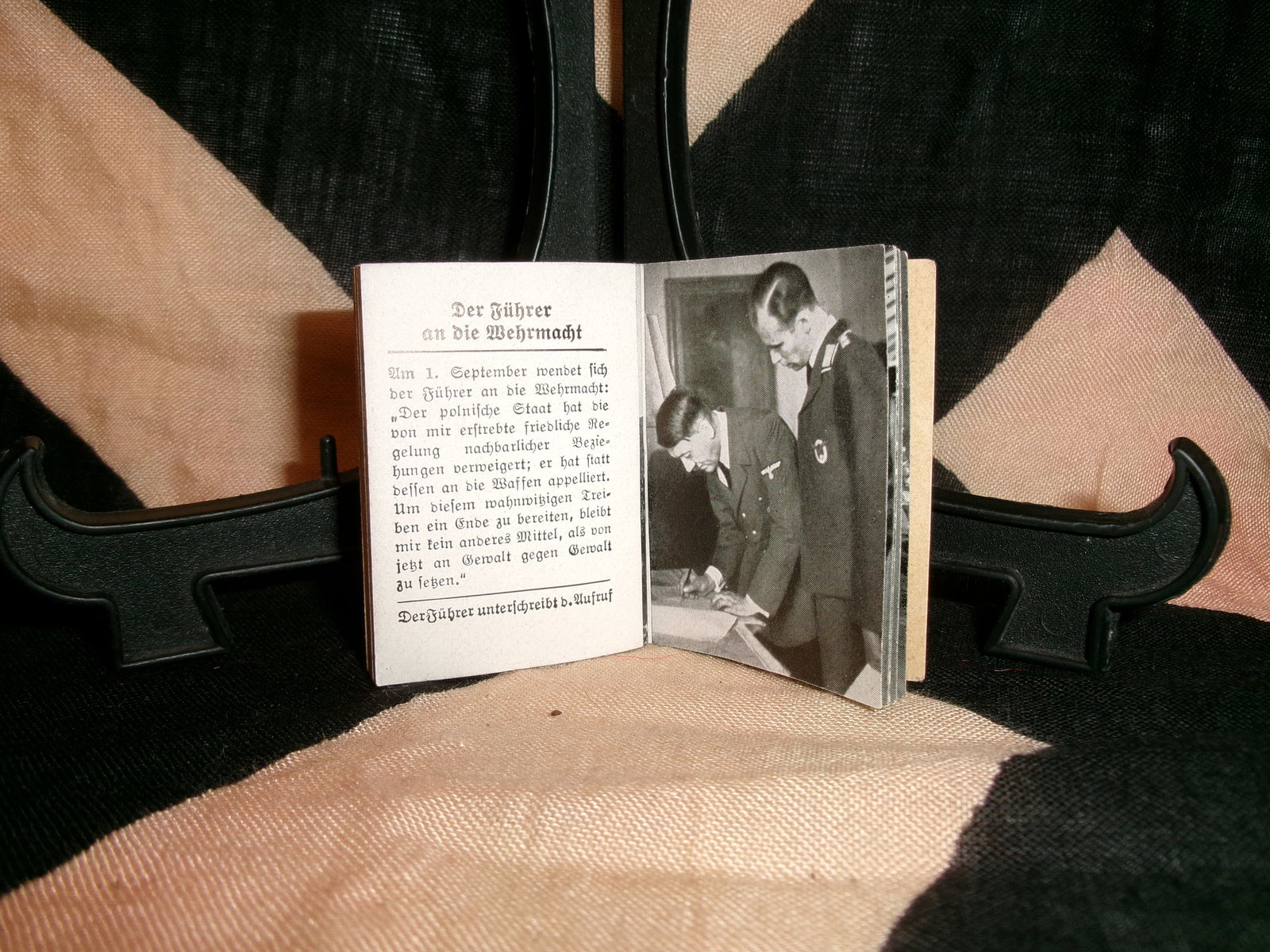 WWII German Propaganda Booklet “Des Führers Kampf im Osten: This small-format printed booklet contains photographic imagery and text promoting wartime narratives associated with the Eastern Front. The cover features a portrait of Adolf Hitler, while interior p