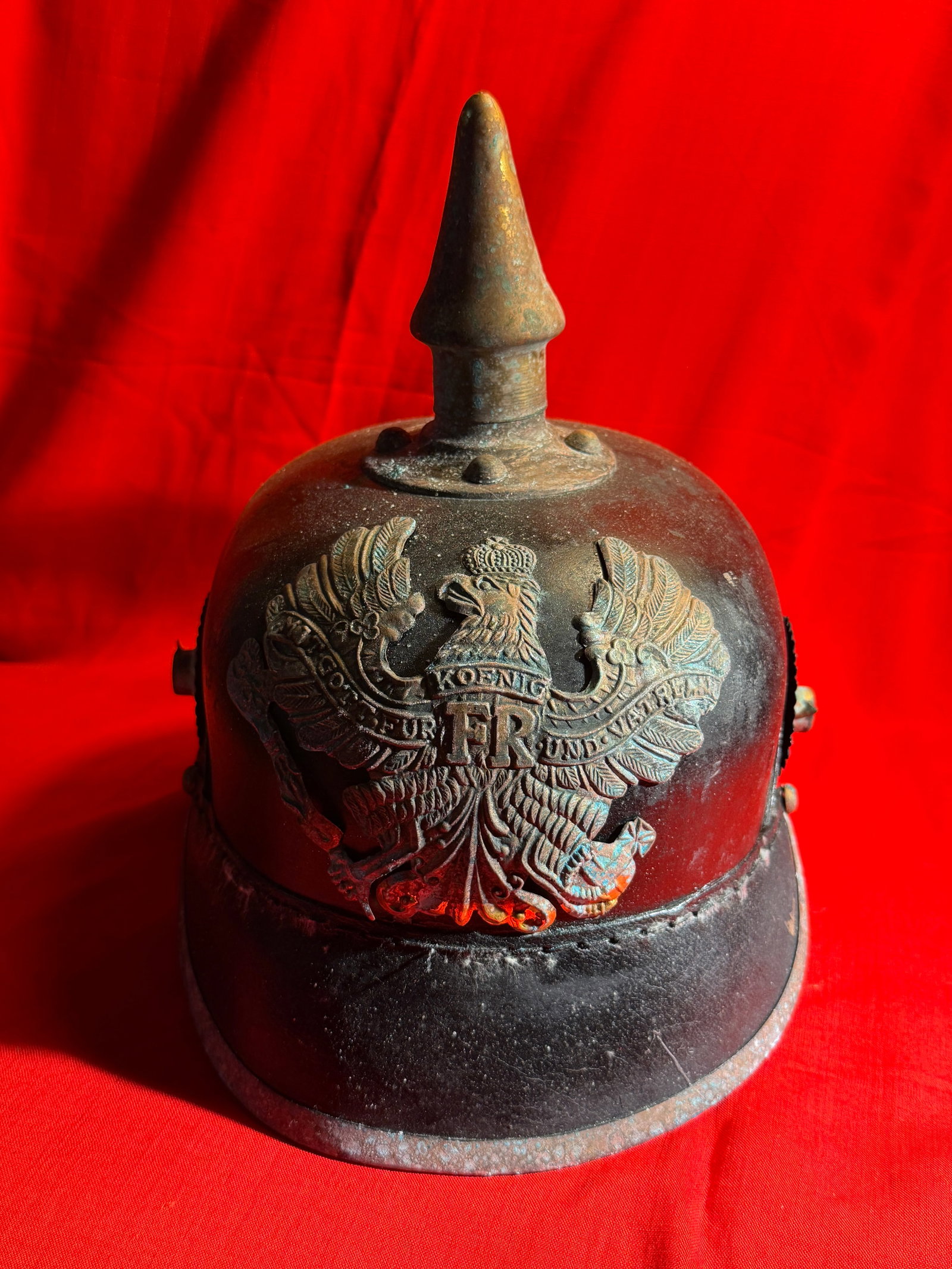 WWI Imperial German Pickelhaube Helmet – Prussian (FR Emblem): Vintage leather Pickelhaube helmet featuring a front plate with the crowned Prussian eagle and “FR” cipher (Friedrich Rex), along with the motto “Mit Gott für König und Vaterland.” T