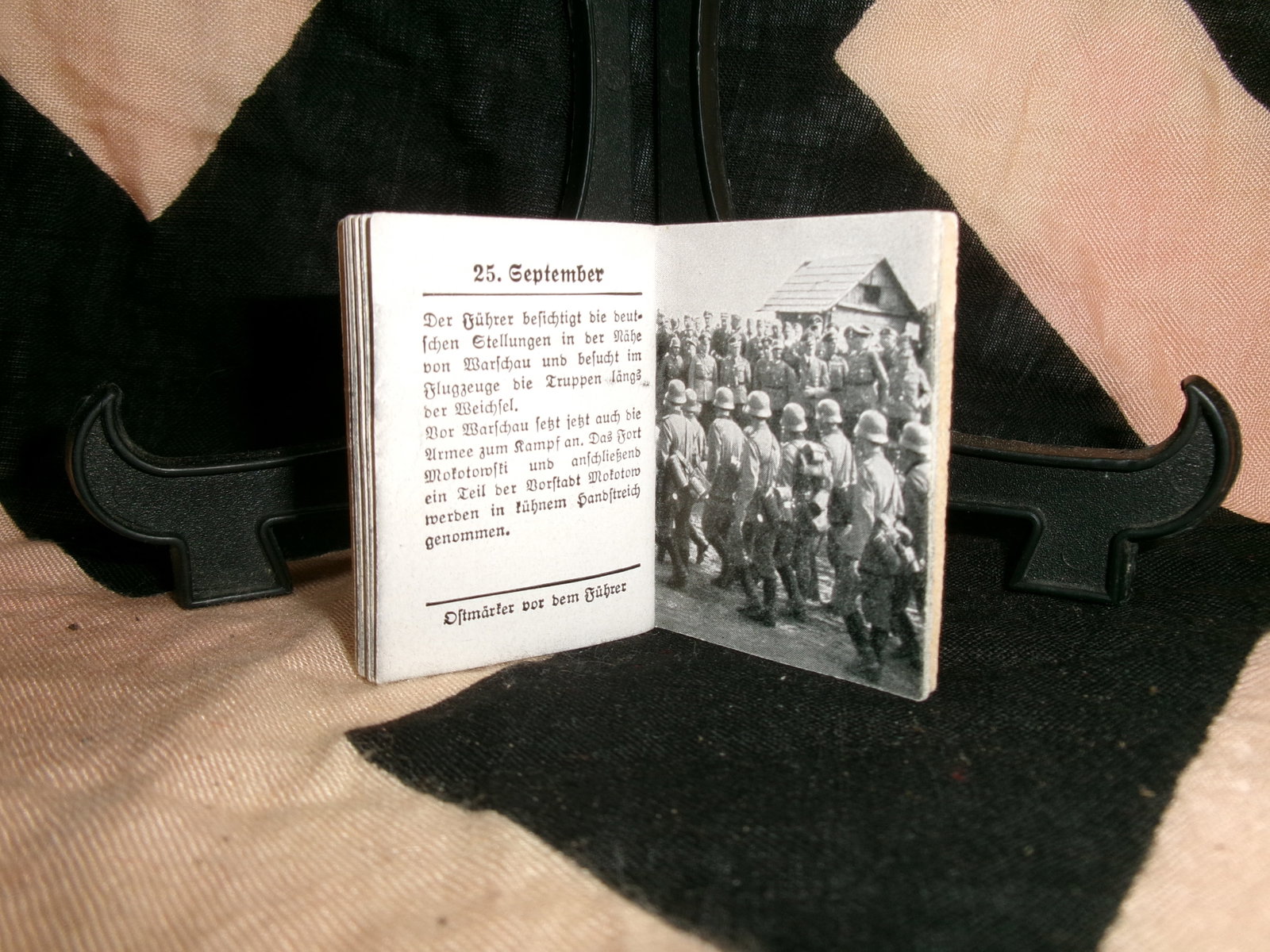 WWII German Propaganda Booklet “Des Führers Kampf im Osten 3?? (Winterhilfswerk Series): This small booklet, part of the Winterhilfswerk (Winter Relief) series, features imagery of Adolf Hitler observing military operations, alongside interior pages with dated text and photographs of Germ