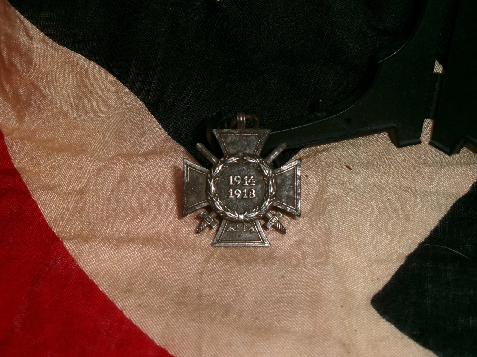 WW1 German Hindenburg Cross with Swords (1914–1918) – Combatant’s Honor Cross Medal: German WW1 Honor Cross (Hindenburg Cross) with Swords, issued to combat veterans of the First World War. The medal features the classic cross pattée design with crossed swords between the arms, signi