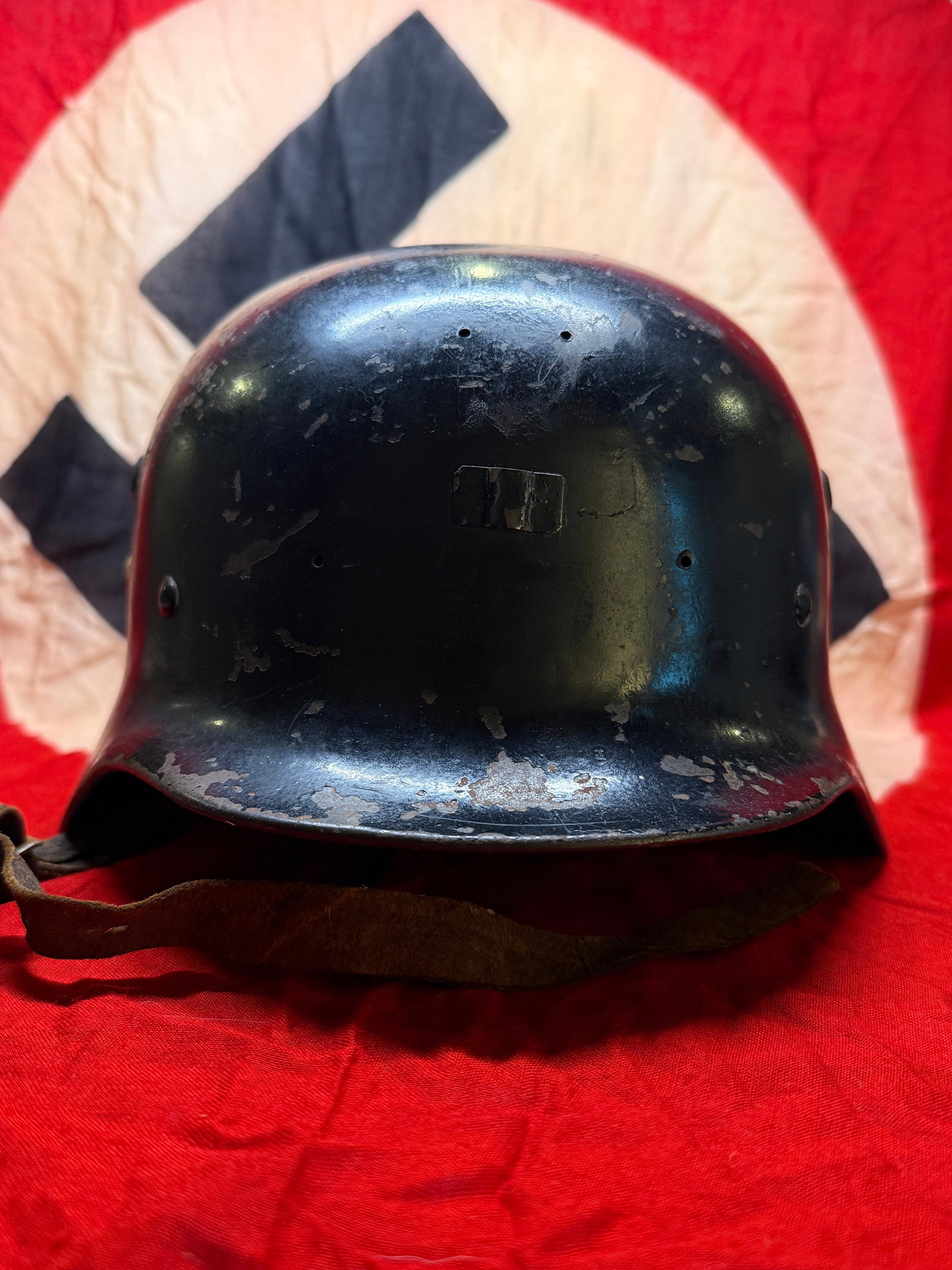 WW2 German Luftwaffe M40 Double Decal Steel Combat Helmet: WW2 German Luftwaffe M40 steel combat helmet, featuring a double decal configuration. The helmet displays the Luftwaffe flying eagle on one side and a tricolor shield on the other, both showing wear c