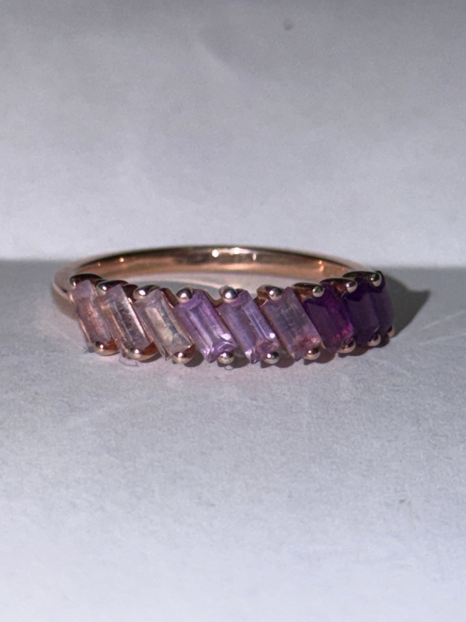 Effy Collection Sterling Silver Amethyst Ring In Rose Gold Tone Sz 6: Elegant Effy Collection ring crafted in sterling silver with a warm rose gold tone finish, featuring a stunning row of baguette-cut stones in a beautiful gradient of purple hues. The design transition
