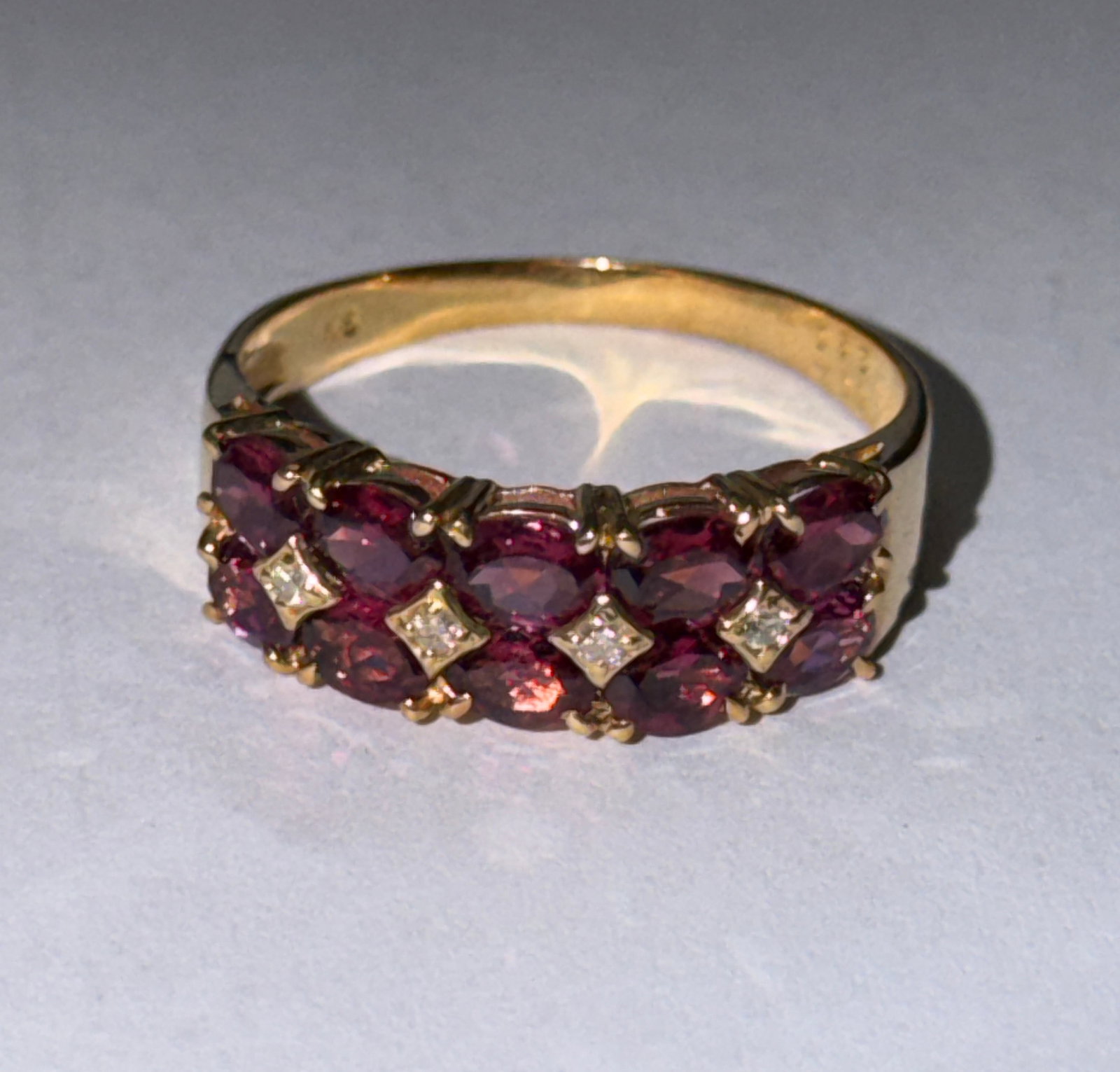 Retro 18K Gold With Pink Rubies Cocktail Ring Sz 7: Striking retro-era cocktail ring crafted in rich 18K yellow gold, featuring a vibrant array of pink rubies arranged in an elegant clustered design. The oval-cut stones are set in a flowing, slightly c
