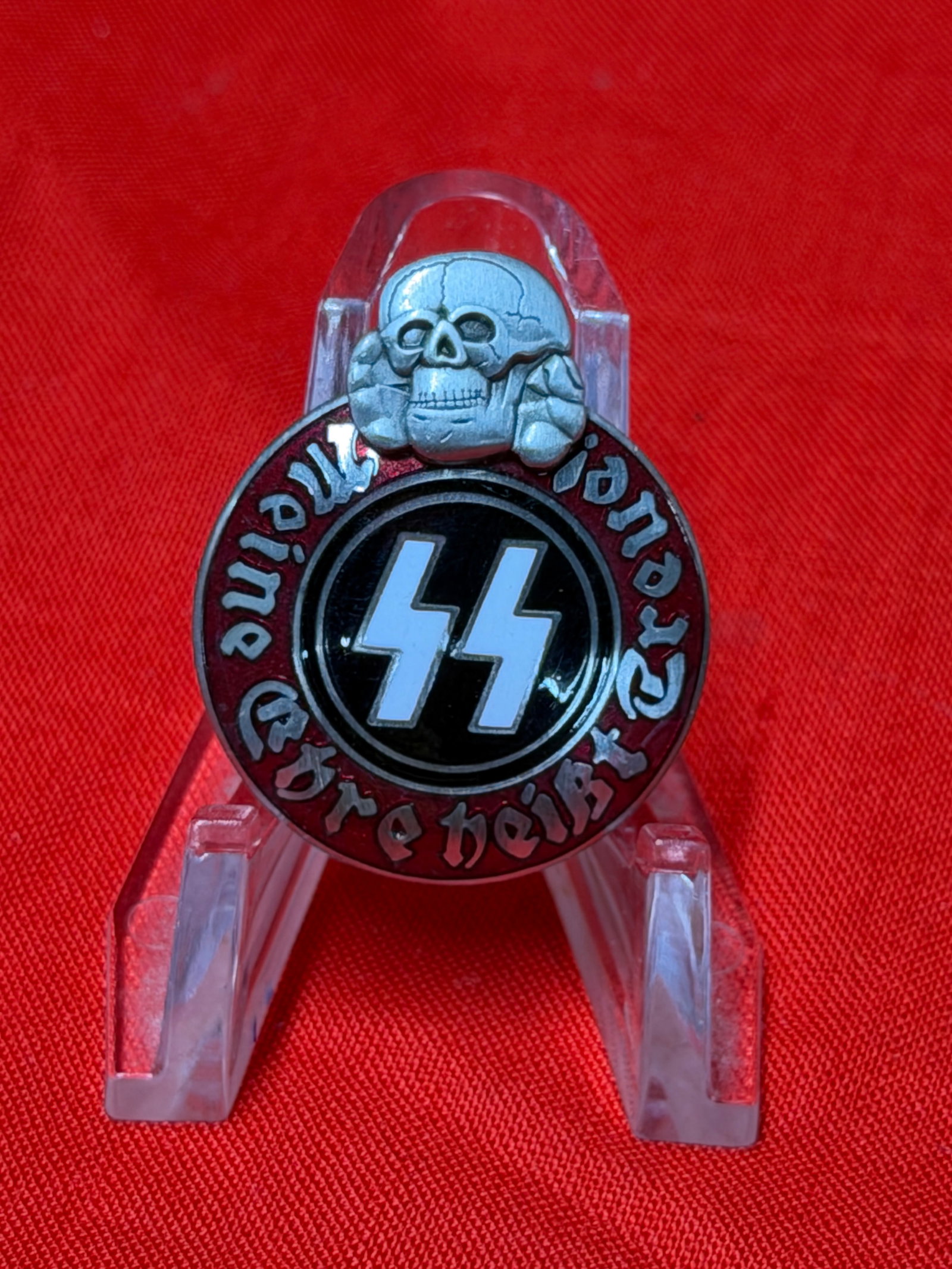 WWII German SS “Meine Ehre Heisst Treue?? Membership Style Badge Marked M1/42: WWII-era German SS membership-style badge featuring the SS runes to the center with surrounding “Meine Ehre Heisst Treue” motto and skull design at the top. The badge features multi-piece cons