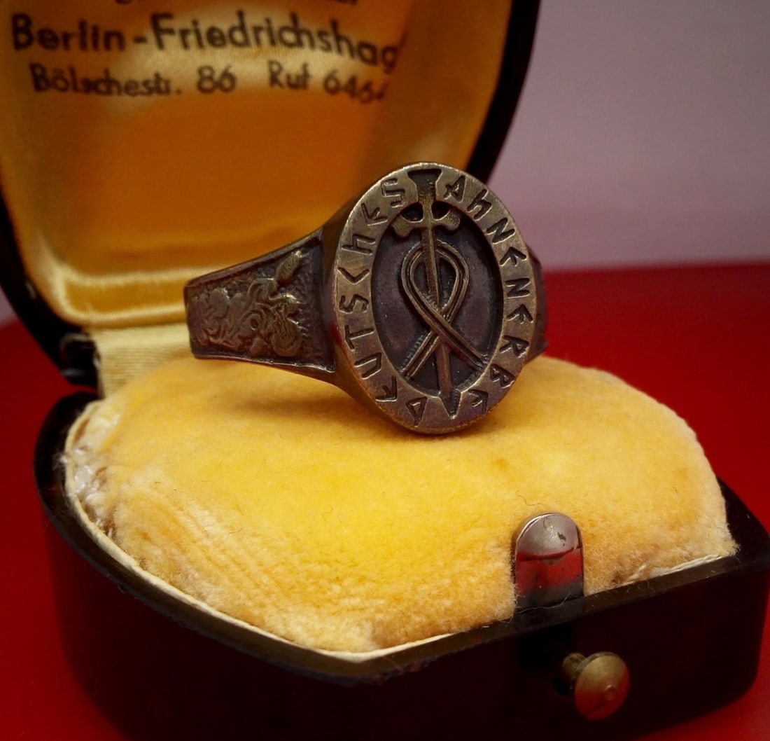 WW2 German Narvik Campaign Waffen Special Regiment Ring with Original Presentation Box: World War II German Narvik campaign ring associated with a Waffen special regiment and retaining its original fitted presentation box. The ring features an engraved runic-style inscription surrounding