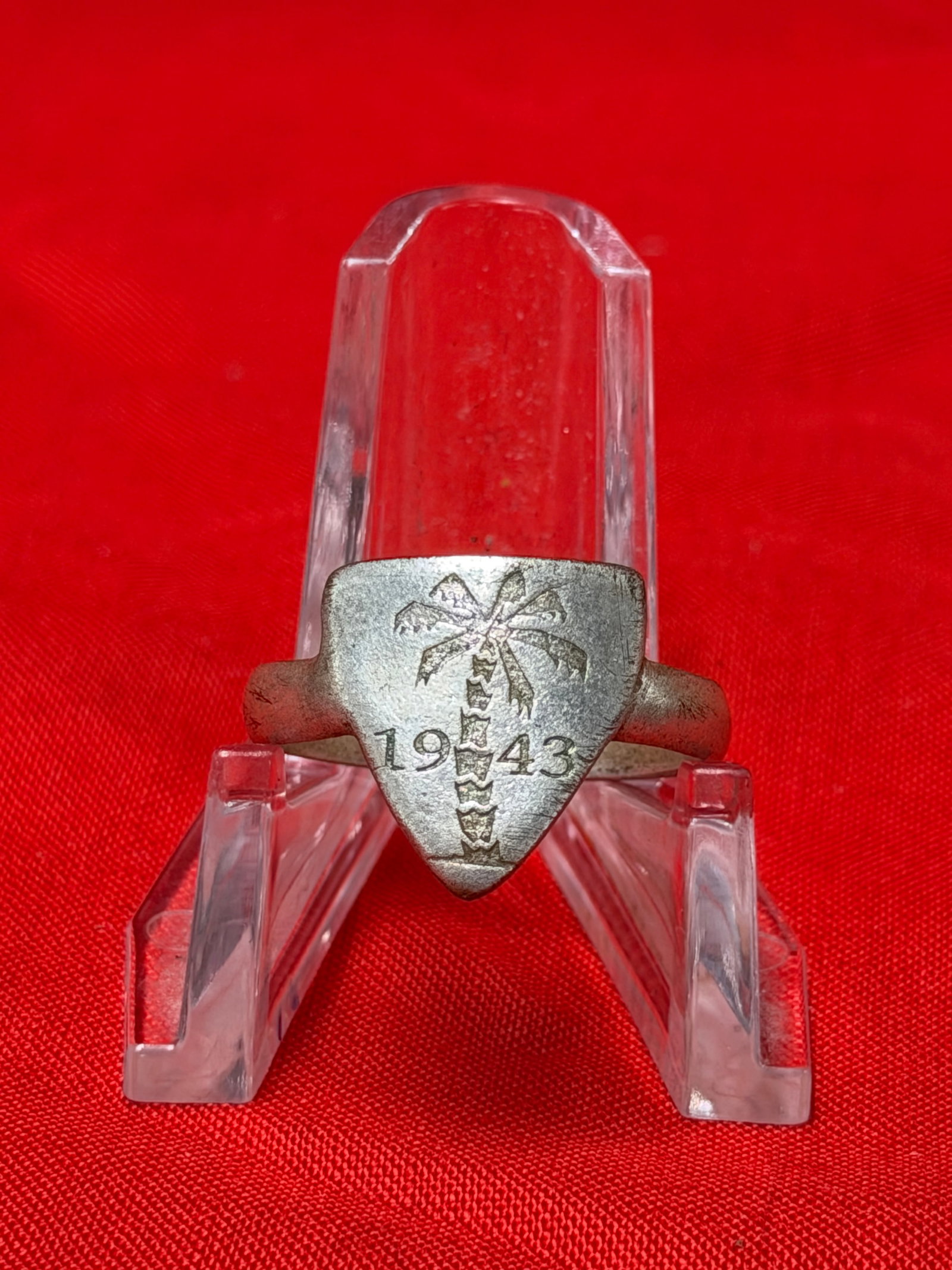 WWII German Afrika Korps / North Africa Campaign Style Ring Dated 1943: WWII German military-style commemorative ring featuring engraved palm tree and “1943” date on shield-shaped face. The palm tree motif is commonly associated with German Afrika Korps and North 