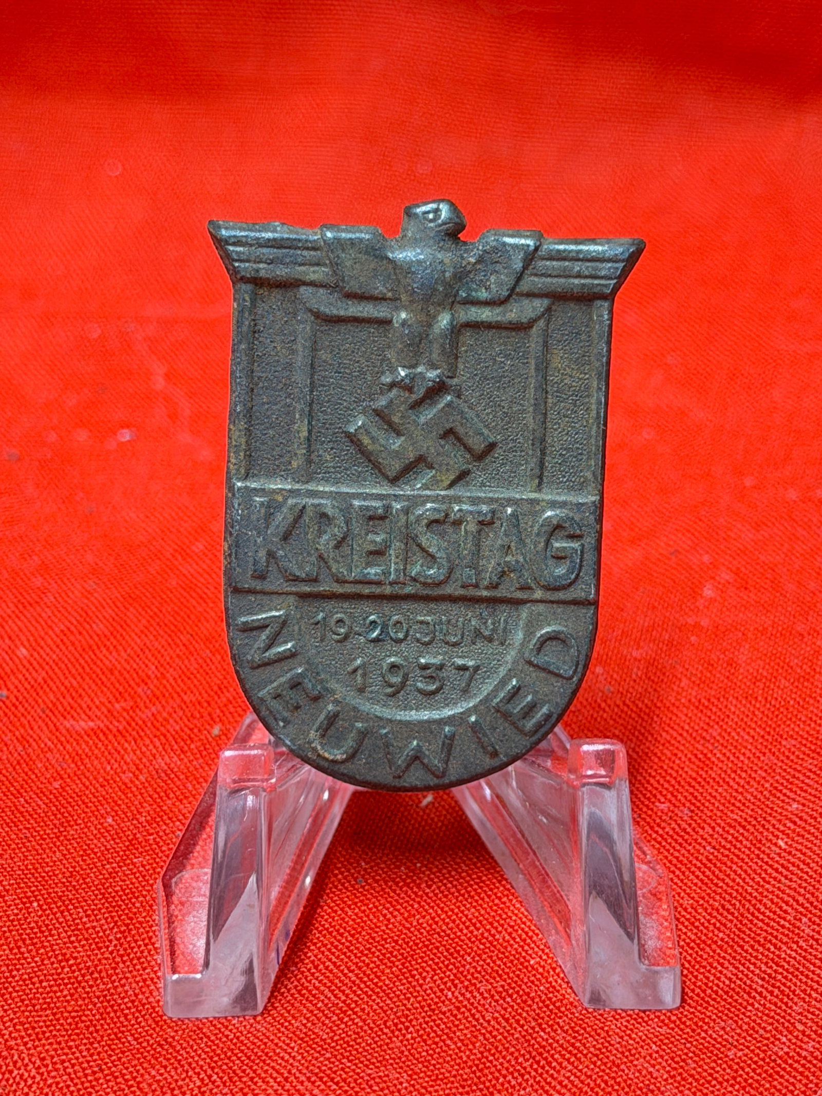 1937 Kreistag Neuwied Metal Pin Badge – German Historical Event Collectible: 1937 “Kreistag Neuwied” metal pin badge featuring embossed lettering, eagle motif, and dated “19–20 Juni 1937” center detail. In our opinion, this is an interesting historical collec