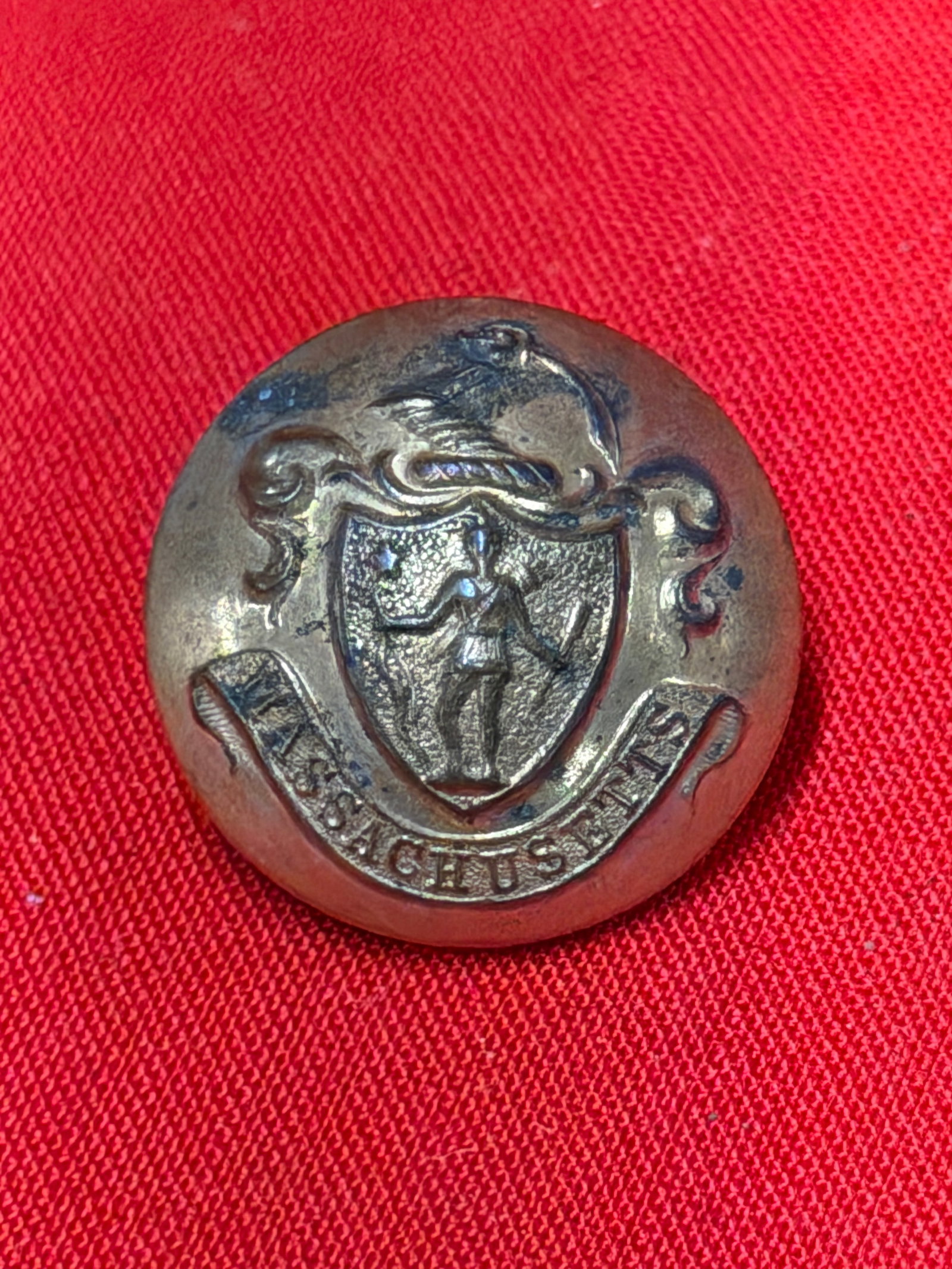 Civil War Massachusetts State Seal Uniform Coat Button Scovill Waterbury Conn: In our opinion, this Civil War era Massachusetts state seal uniform coat button features the classic Massachusetts militia crest with Minuteman figure and “Massachusetts” banner detail. Revers