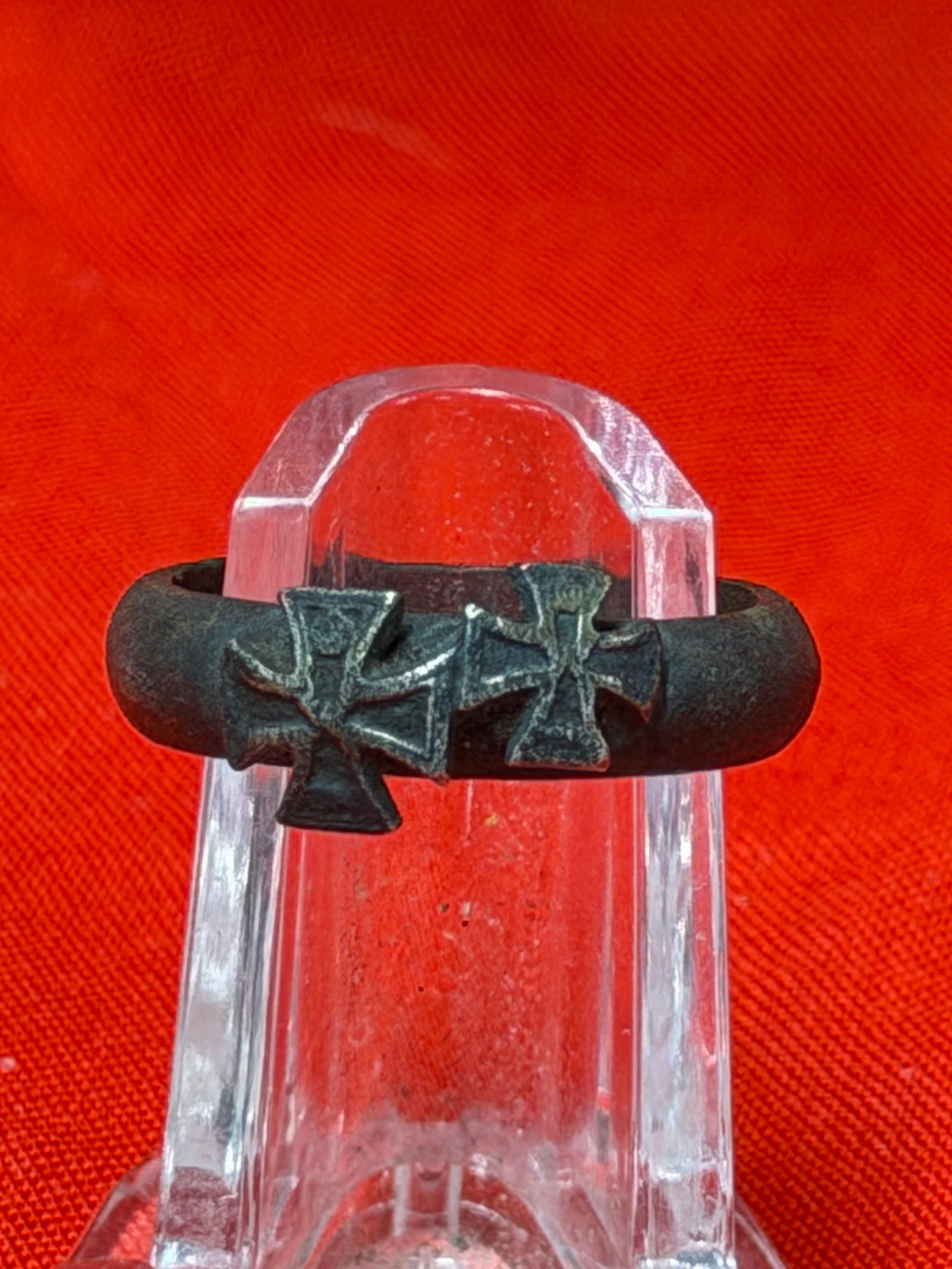 WW2 German Iron Cross Style Black Metal Ring Marked 807: This black metal ring features three raised Iron Cross style emblems across the top of the band with a dark aged finish and interior marking numbered 807. In our opinion, this piece resembles military