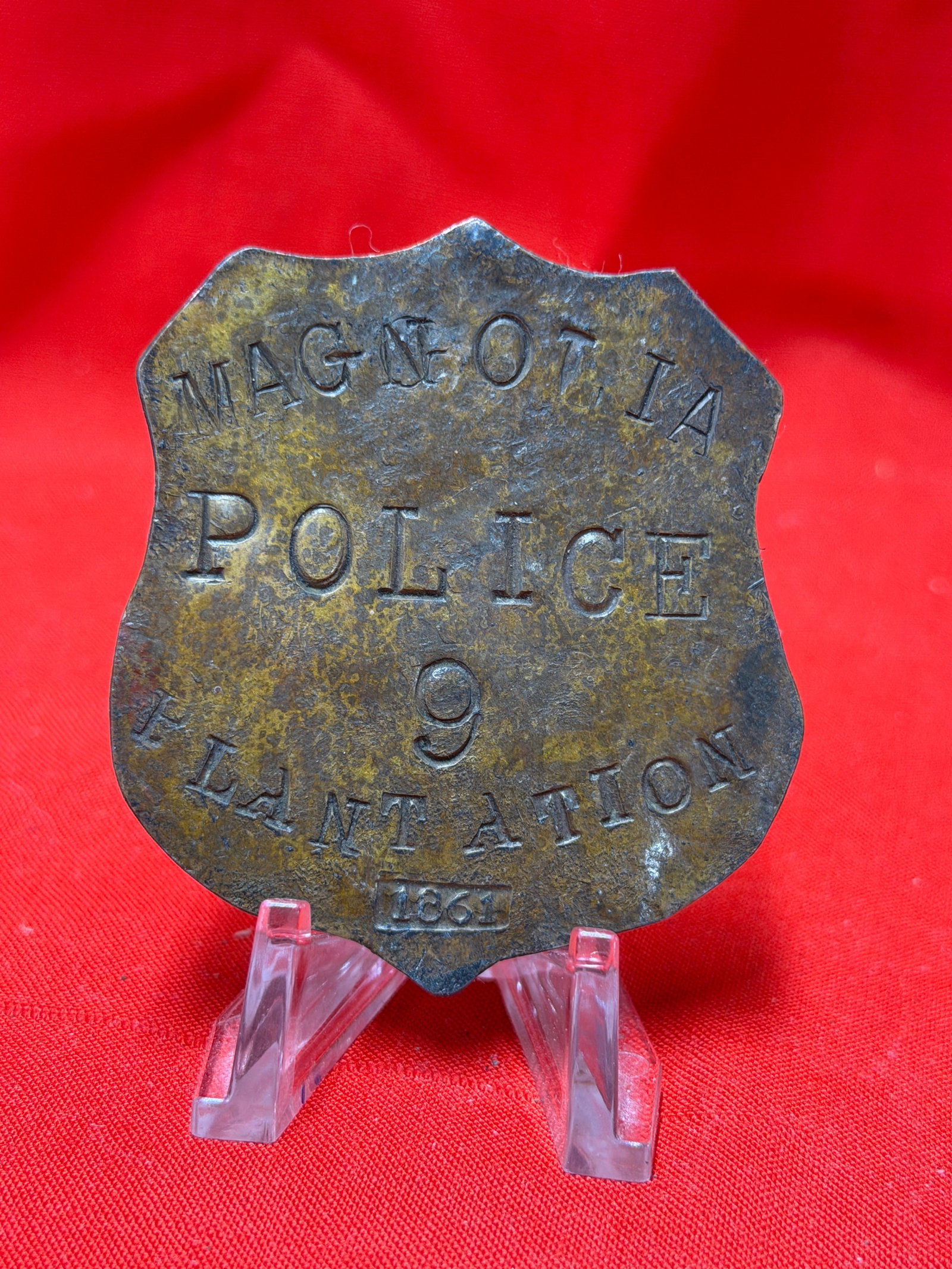 Civil War Era Style Magnolia Police Atlanta 1861 Brass Badge Southern Historical Collectible: Shield form brass police style badge marked “MAGNOLIA POLICE 9 ATLANTA 1861” with hand cut lettering and aged surface patina throughout. In our opinion this piece appears connected to Civil Wa