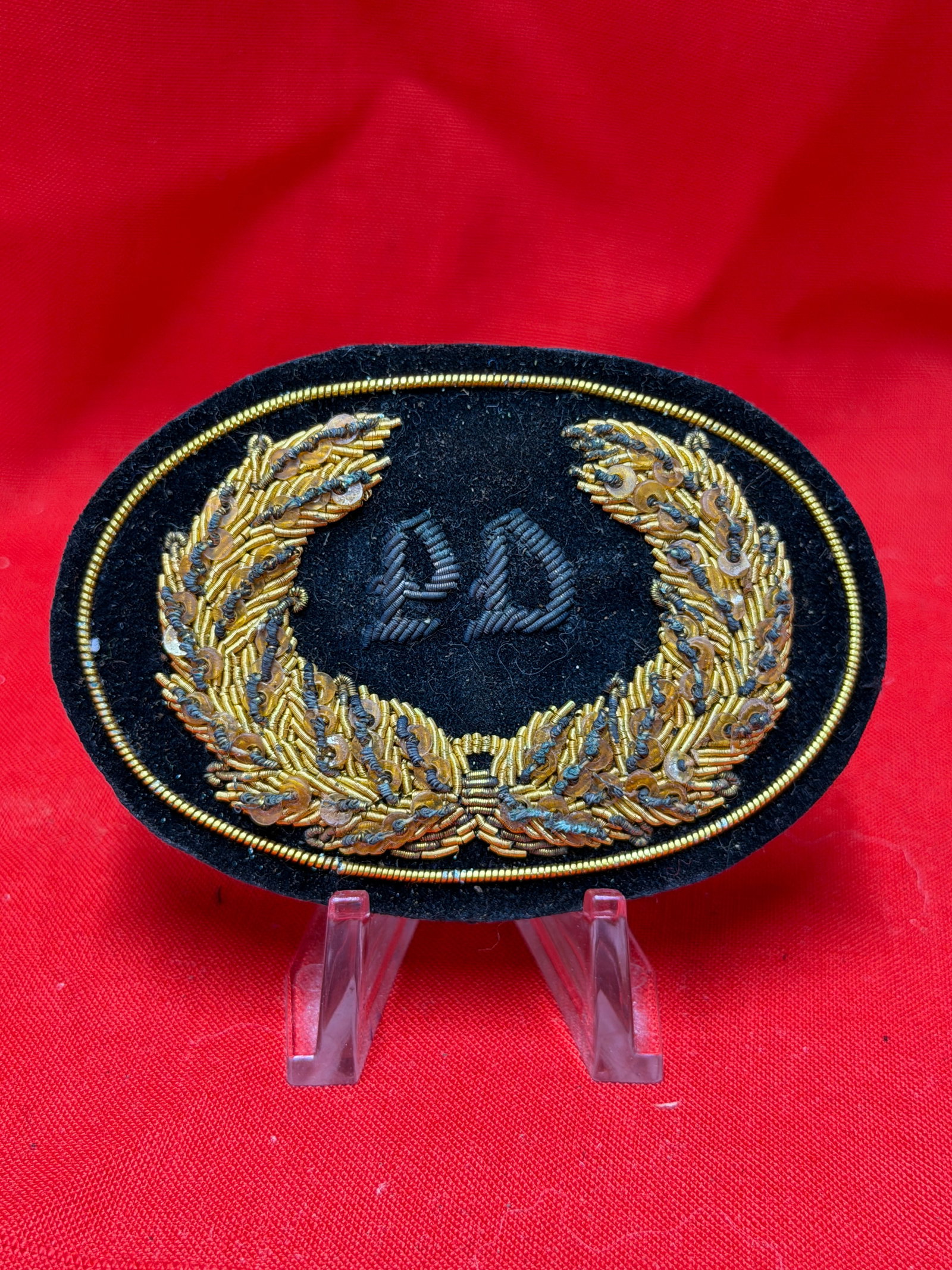 Civil War Era PD Police Department Bullion Hat Badge Schuyler Hartley & Graham: Civil War era style Police Department bullion hat badge featuring finely hand embroidered gold bullion wreath surrounding embroidered “PD” initials on black felt backing. Reverse retains maker