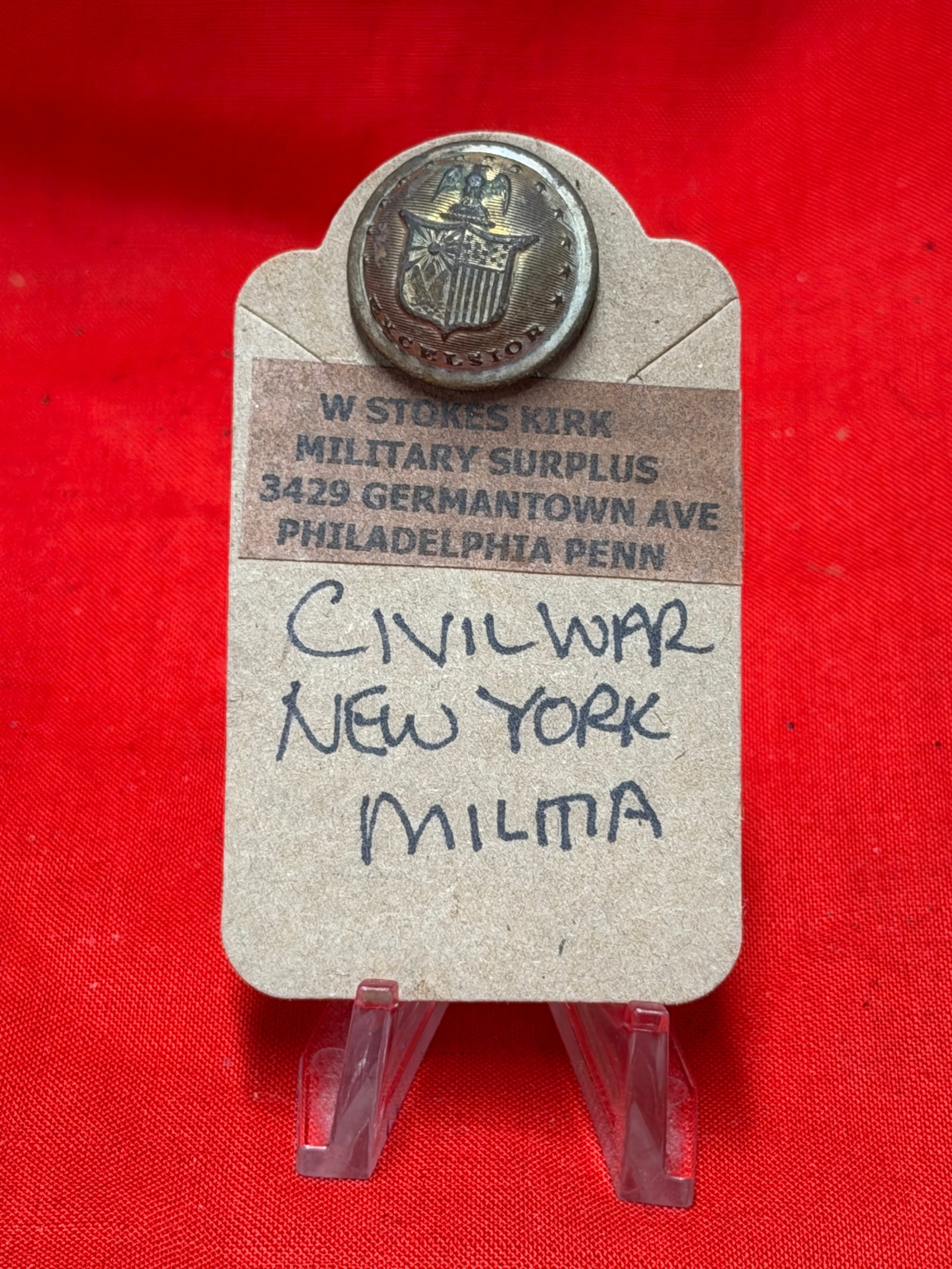 Civil War Era New York Militia Excelsior Coat Button Military Uniform Relic: Small brass military uniform button featuring New York state style shield with eagle and “Excelsior” motto to front. In our opinion this piece resembles a Civil War era New York militia or sta