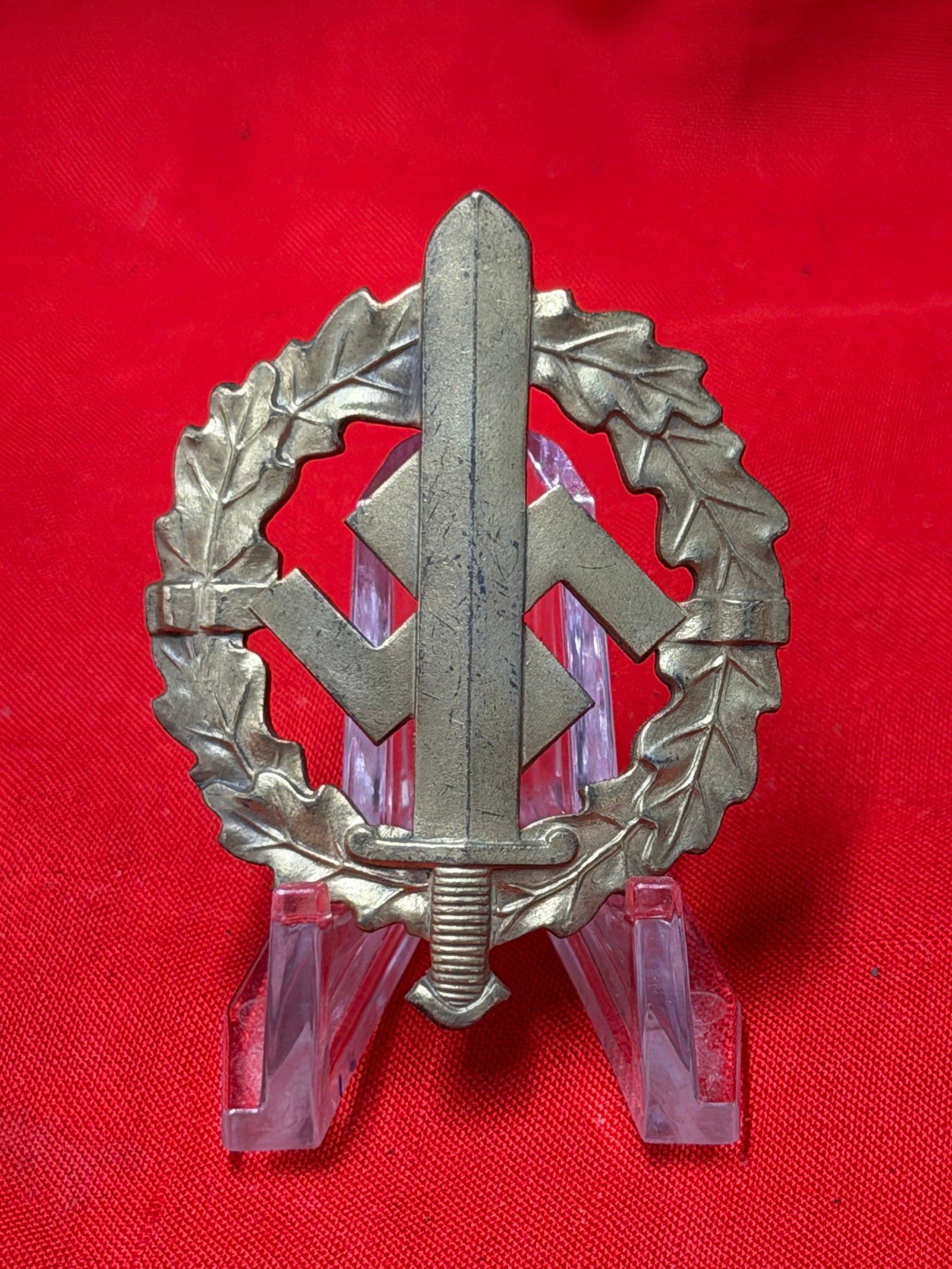 WW2 German SA Sports Badge Bronze Grade by L. Chr. Lauer Nürnberg Berlin: WW2 German SA Sports Badge featuring the upright sword and swastika within oakleaf wreath design. Reverse marked “L. Chr. Lauer Nürnberg Berlin” with serial number “312206” visible al
