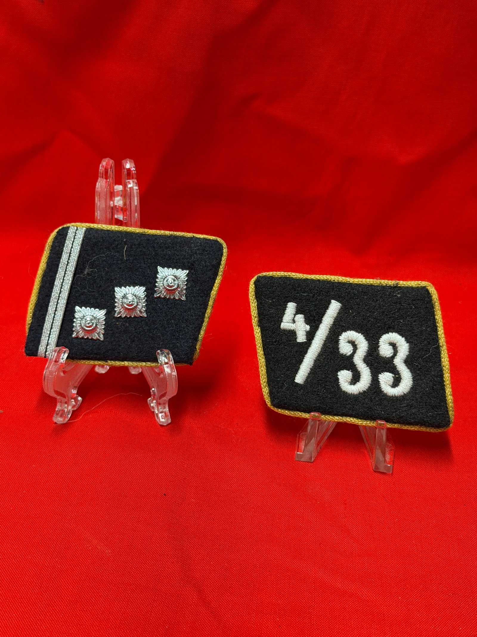 WW2 German Waffen SS 4/33 Collar Tab Pair Black Wool Uniform Insignia Set: Pair of WW2 German Waffen SS style collar tabs constructed on black wool backing with gold edge piping. One tab displays the embroidered “4/33” unit style marking while the opposing tab featur