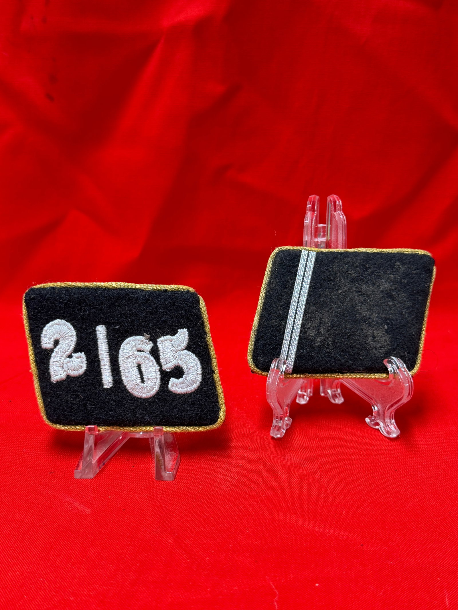 WW2 German Waffen SS Division 2/65 Shoulder Boards Tabs Pair RZM Marked: Pair of German uniform shoulder board tabs featuring embroidered “2/65” numerals on black wool backing with gold/yellow piping. Reverse side retains original construction details, including vi