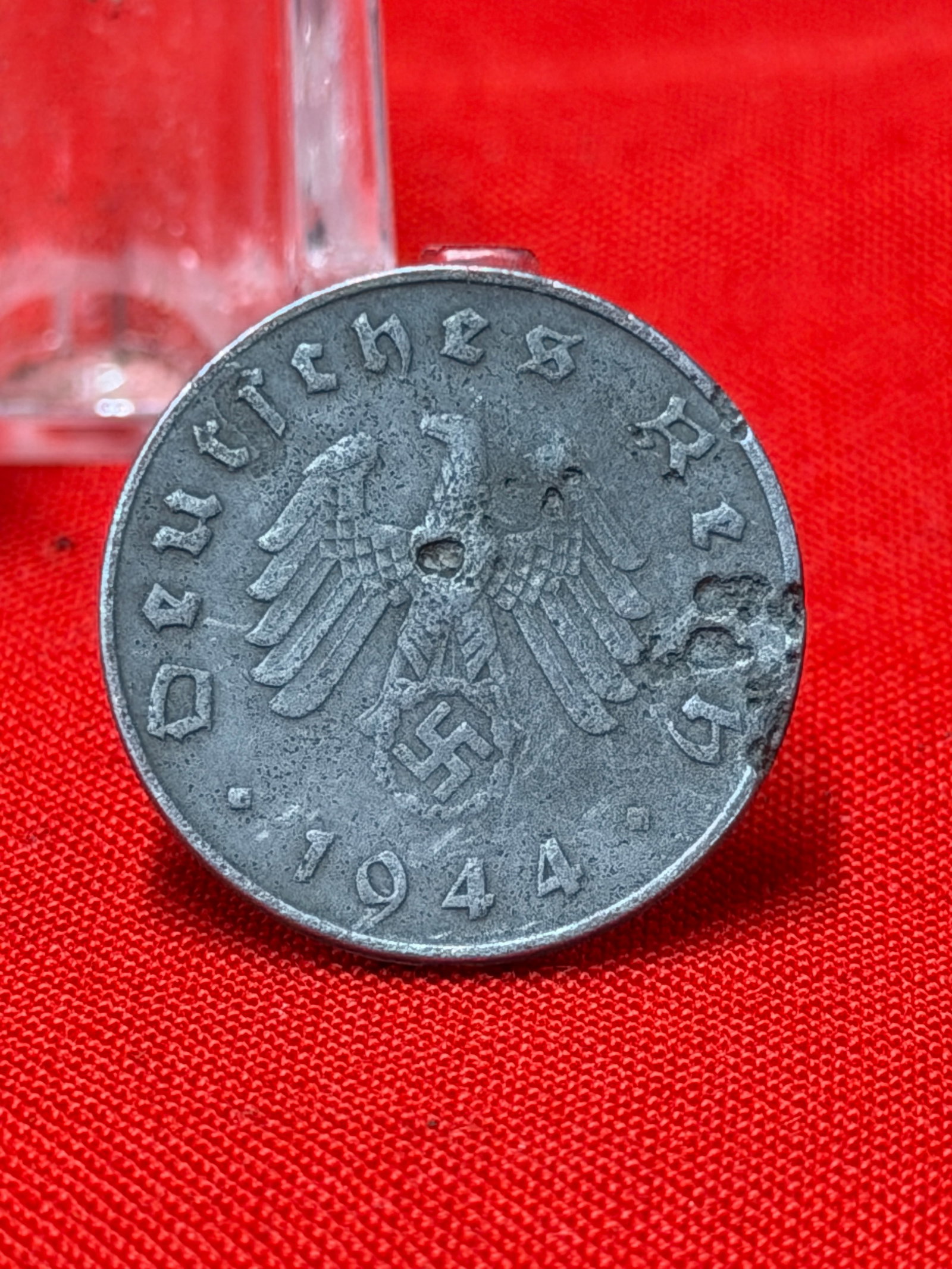 WWII German 10 Reichspfennig Coin 1944 Deutsches Reich: WWII German 10 Reichspfennig coin dated 1944 featuring the Deutsches Reich eagle and reverse denomination design. In our opinion this piece represents a wartime German era coinage collectible from the