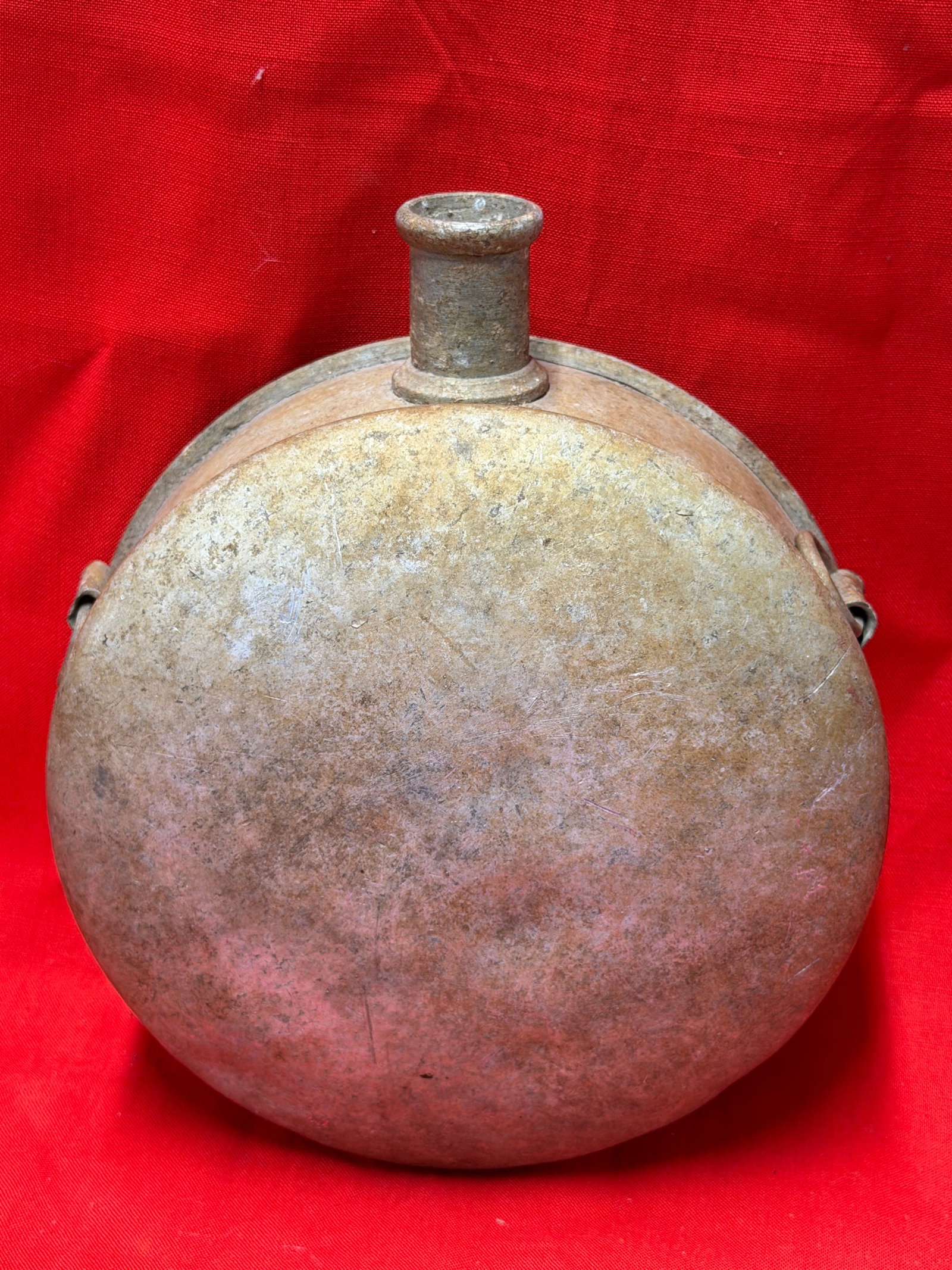 Civil War Confederate CSA Tin Drum Canteen: Civil War-era Confederate tin drum canteen believed to be Southern/CSA manufacture, featuring classic two-piece soldered construction with side strap loops and intact threaded-style spout. This exampl