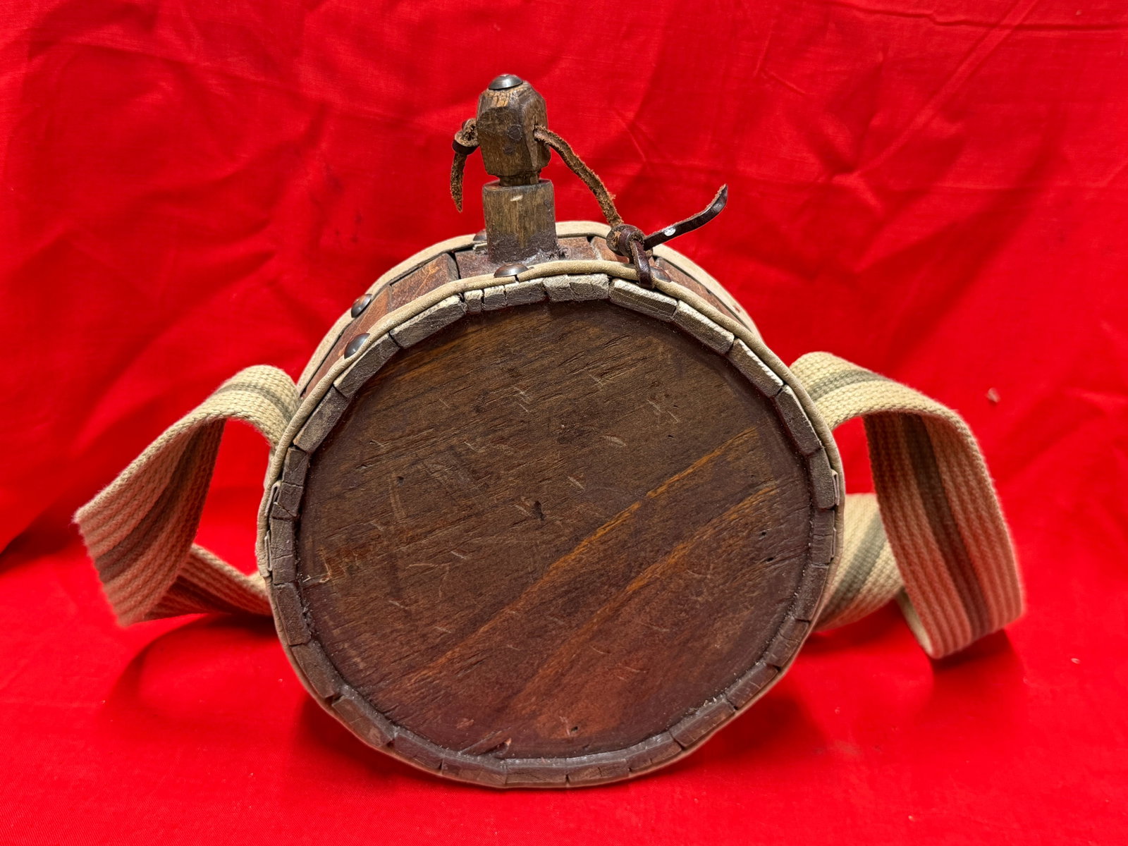 Civil War Confederate Wooden Drum Canteen With Canvas Sling Primitive Field Gear: Civil War Confederate wooden drum form canteen with woven canvas sling and wooden stopper assembly. In our opinion this piece displays characteristics associated with Confederate field made or souther