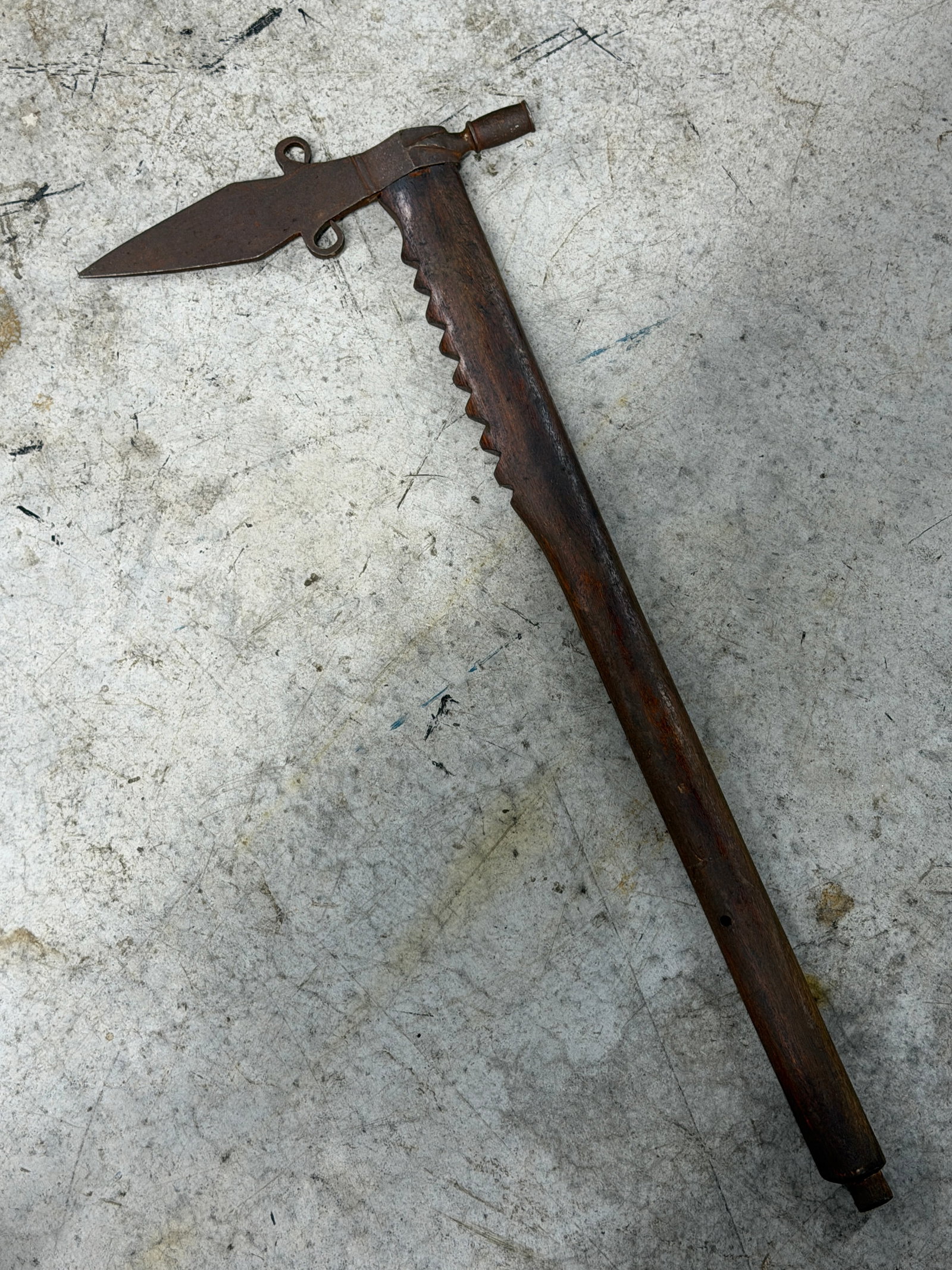 1800’s Native American Smoking Pipe Tomahawk Attributed to Plains Indians: 1800’s Native American smoking pipe tomahawk is attributed to Plains Indians. Features a hand forged iron spear point tomahawk head with dual side loop projections and integrated pipe bowl mounted o