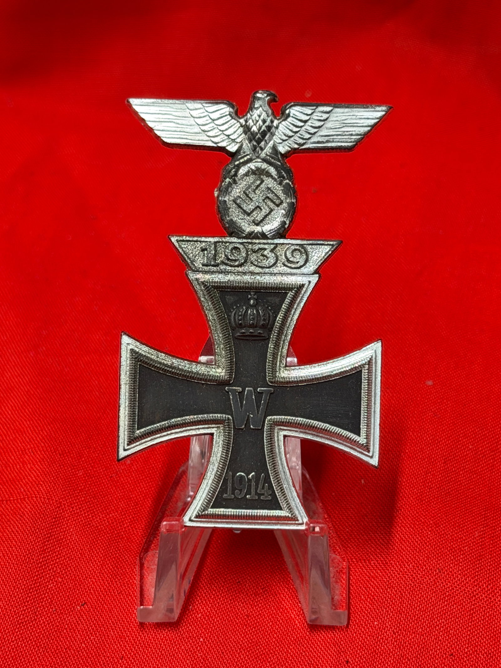 WWII German 1939 Iron Cross First Class With 1939 Spange Badge: WWII German Iron Cross First Class style pinback badge featuring the 1939 date tab, national eagle with swastika, and blackened Iron Cross with “W” center and “1914” lower arm. Constru