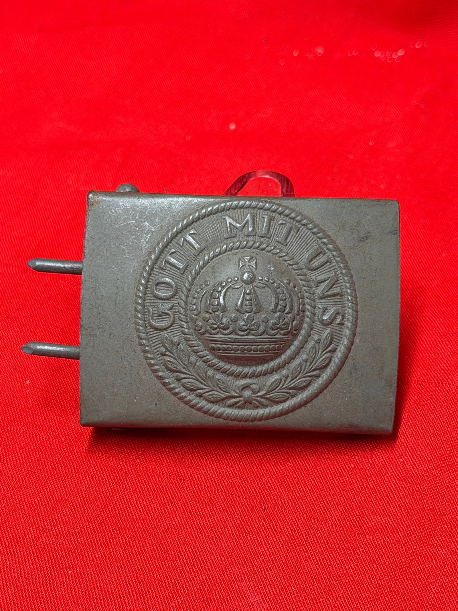 Imperial German Gott Mit Uns Crown Brass Military Belt Buckle: Imperial German military belt buckle featuring the “GOTT MIT UNS” motto surrounding a crowned center emblem with laurel detailing. Steel and brass-tone construction with attached rear belt hoo