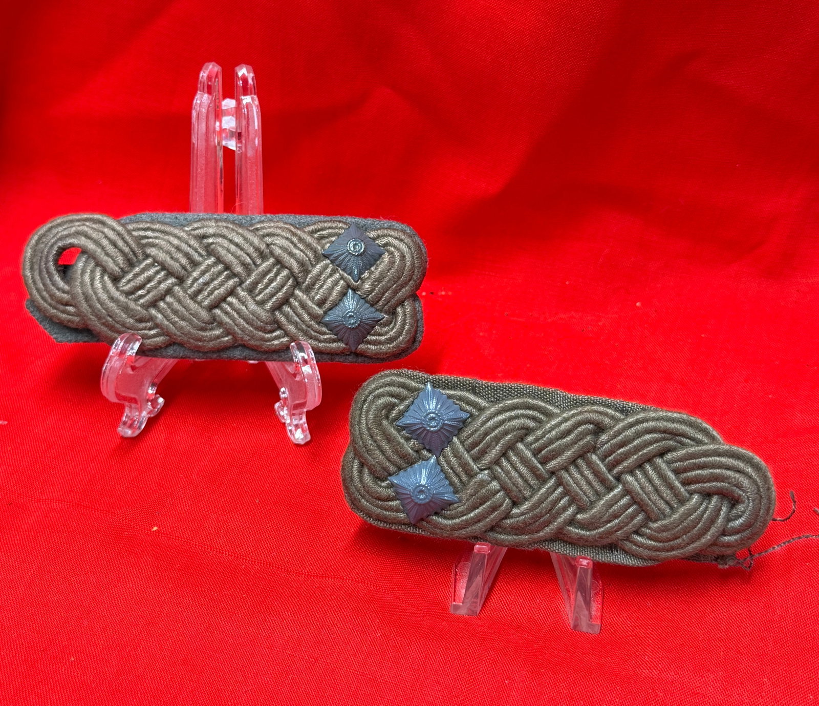 WWII German Military Shoulder Board Pair: This pair of Second World War German military shoulder boards features braided olive cord construction with dark backing and metal rank pips attached to each board. In our opinion the set displays per