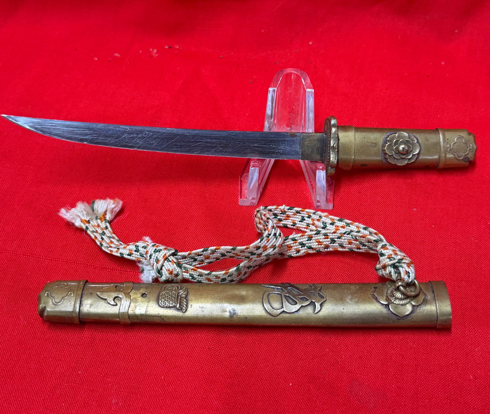 WW2 Japanese Brass Tanto Letter Opener / Miniature Samurai Dagger with Scabbard: This vintage Japanese style miniature tanto dagger or letter opener features a polished steel blade housed in an ornate brass scabbard with decorative floral and symbolic accents. The matching brass h